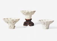 Three Chinese Dehua Porcelain Libation Cups and a Wood Stand