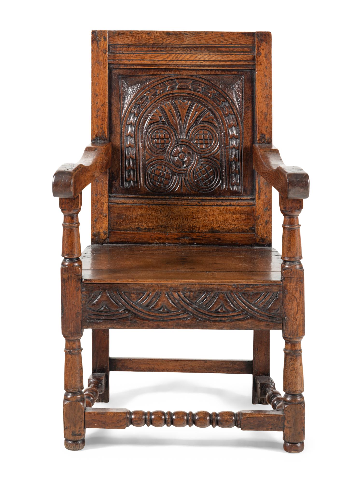 A William and Mary Carved Oak Open Armchair