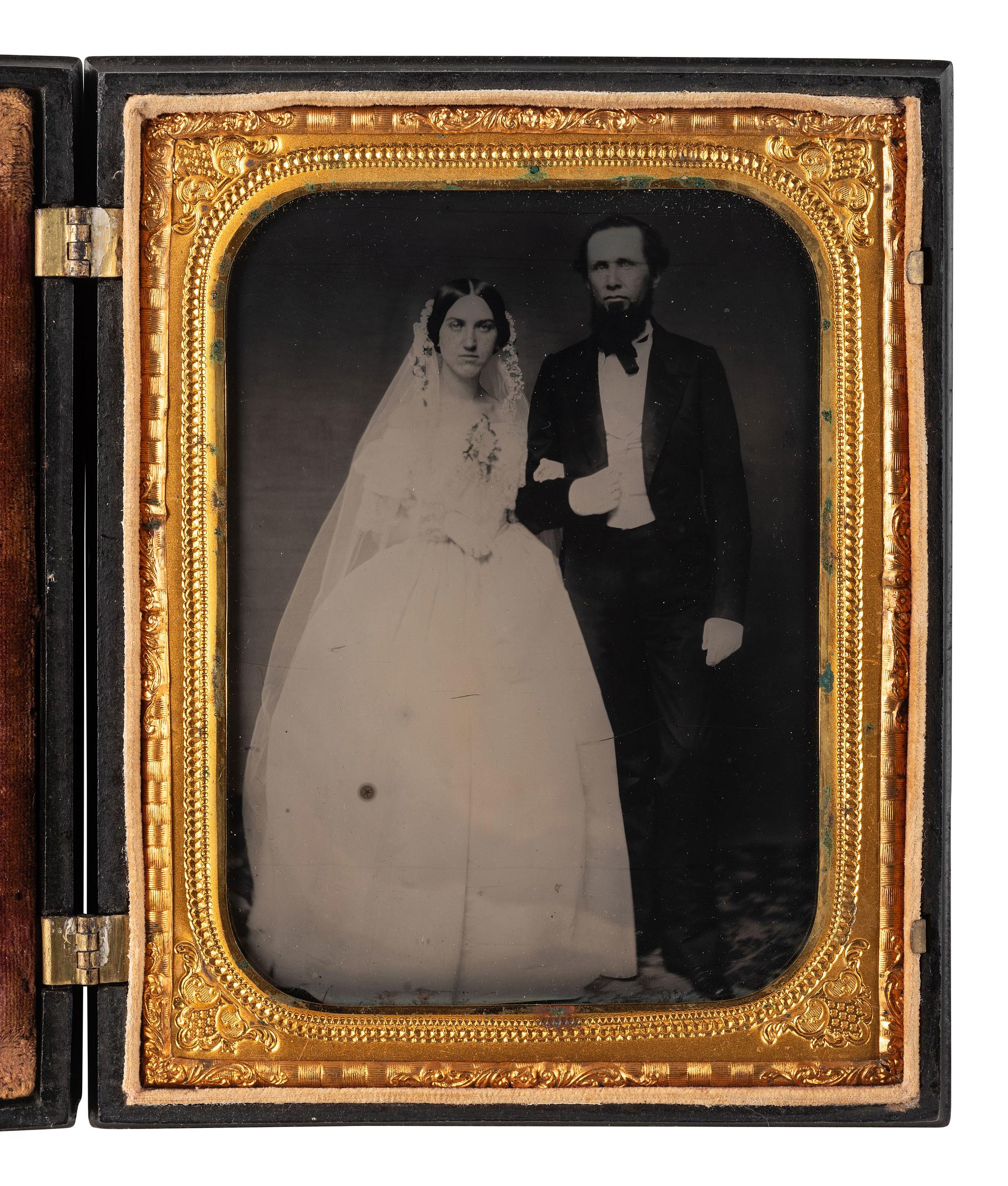 [EARLY PHOTOGRAPHY]. 3 half plate figural Union cases, one containing tintype of a wedding couple.