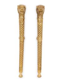 A Pair of Continental Chased Brass Door or Wall Mounts