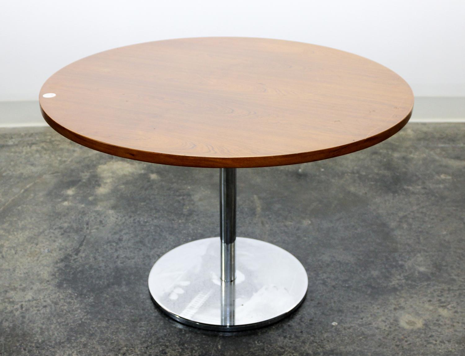 A Circular Danish Teak and Chrome Occasional Table Height 19 3/4 x diameter 29 3/4 inches. — 1950s