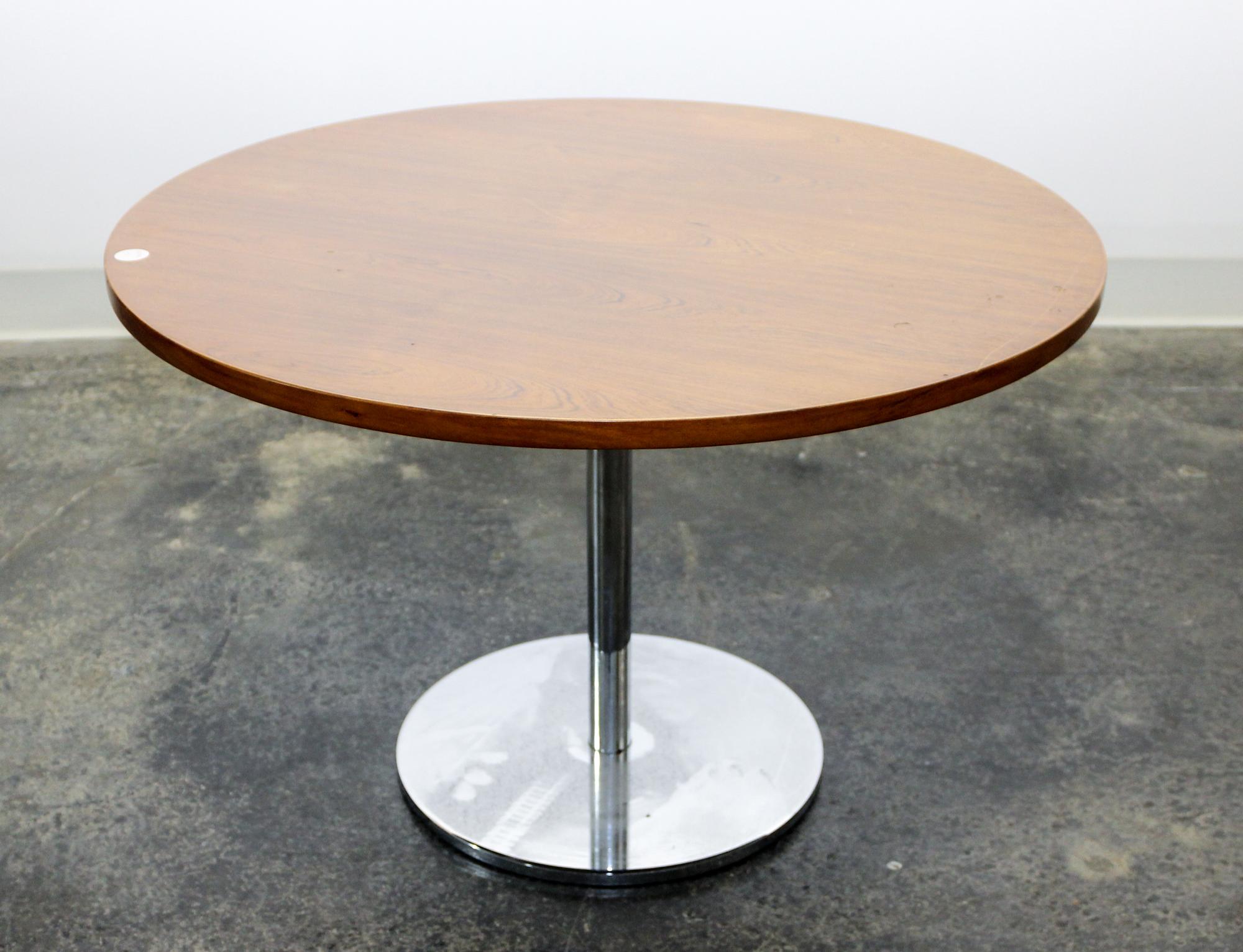 A Circular Danish Teak and Chrome Occasional Table Height 19 3/4 x diameter 29 3/4 inches. — 1950s
