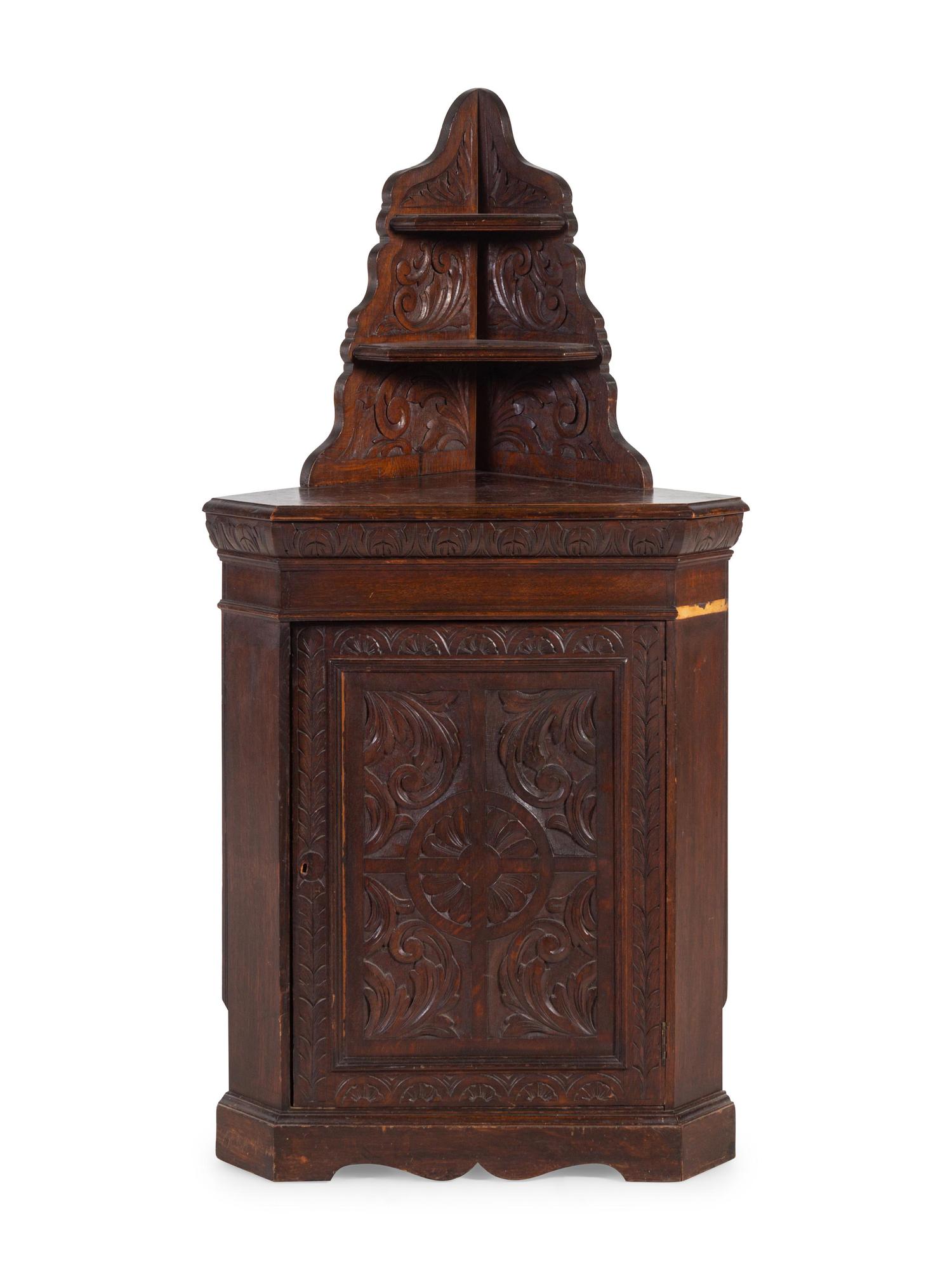 A Renaissance Revival Carved Oak Corner Cabinet
