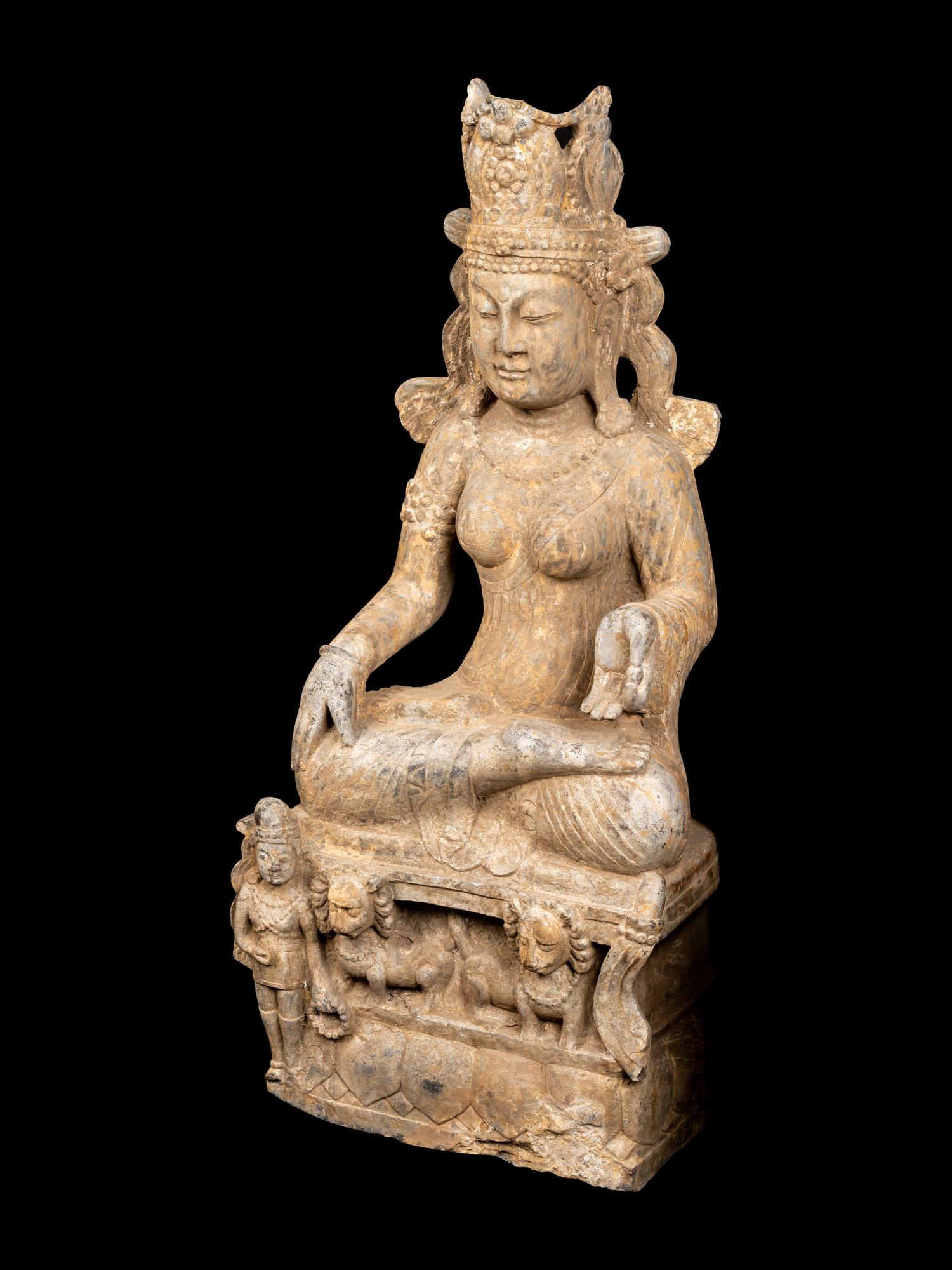 A Chinese Carved Stone Seated Guanyin Figure