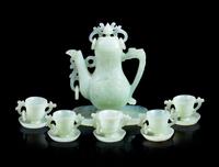 Seven Chinese Celadon Jade Articles Height of wine pot 6 3/8 inches.