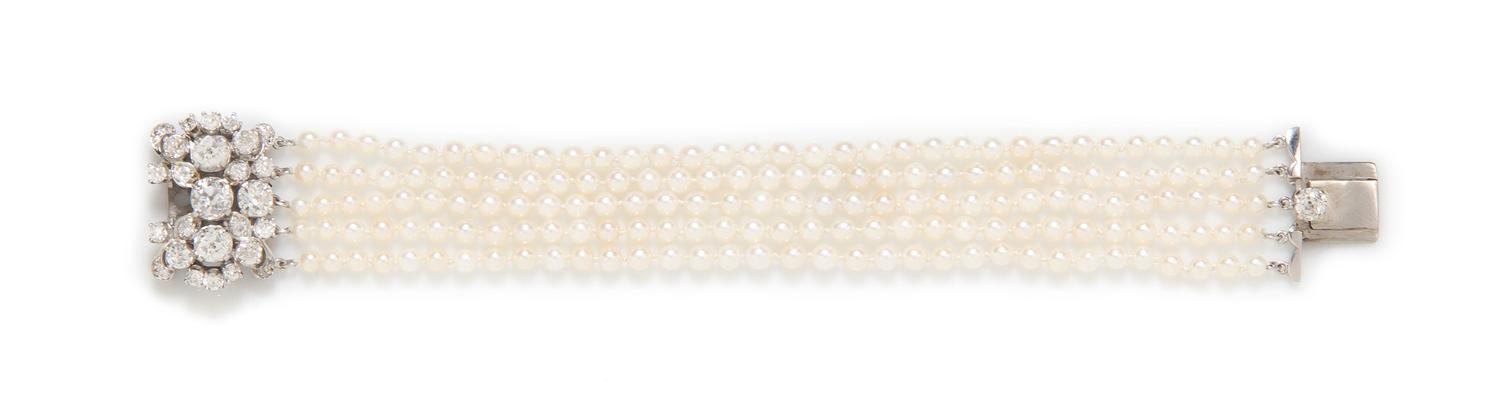An Edwardian Platinum, Diamond and Pearl Multi Strand Bracelet, 17.50 dwts.