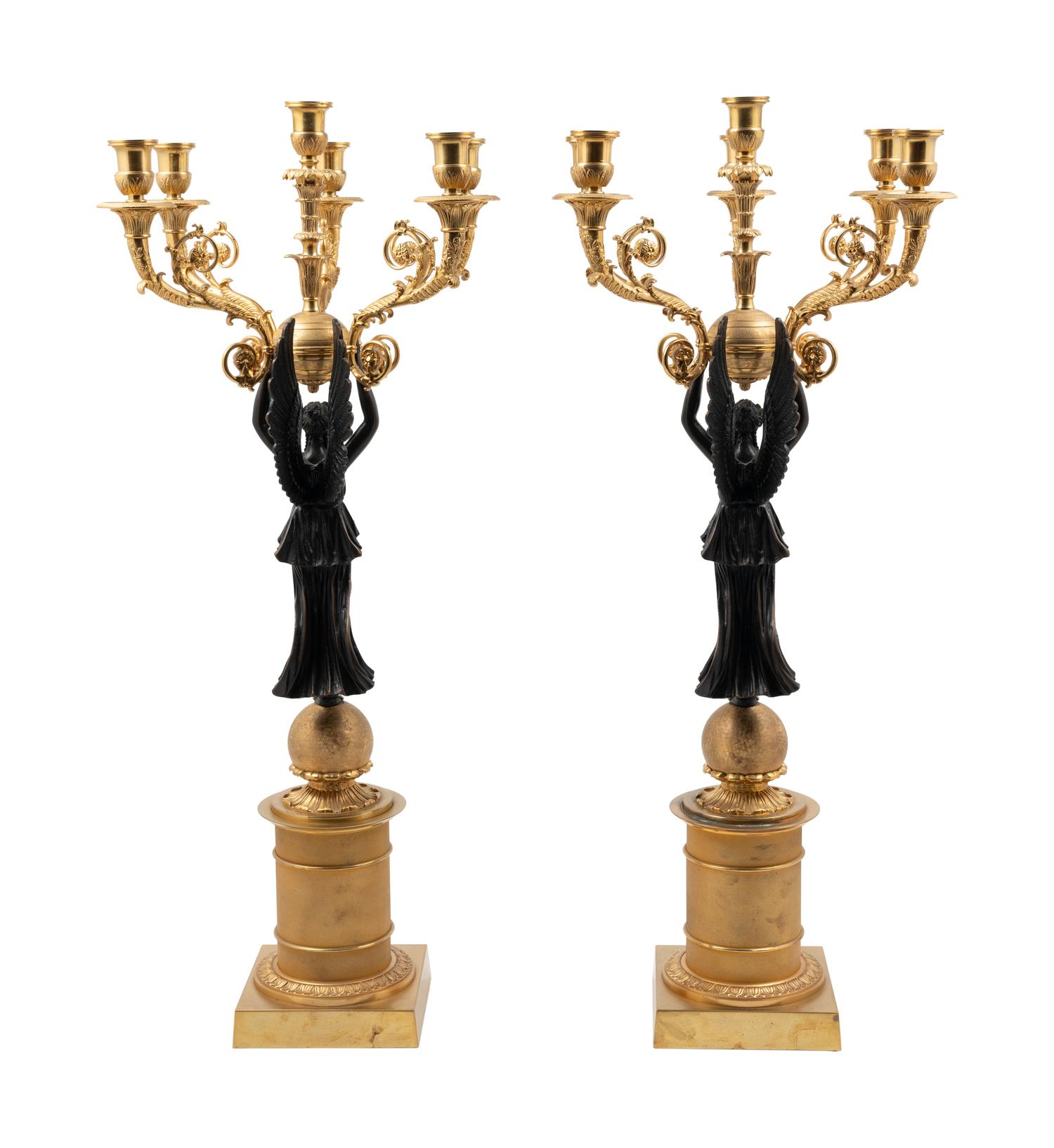 A Pair of Empire Style Gilt and Patinated Metal Six-Light Figural Candelabra