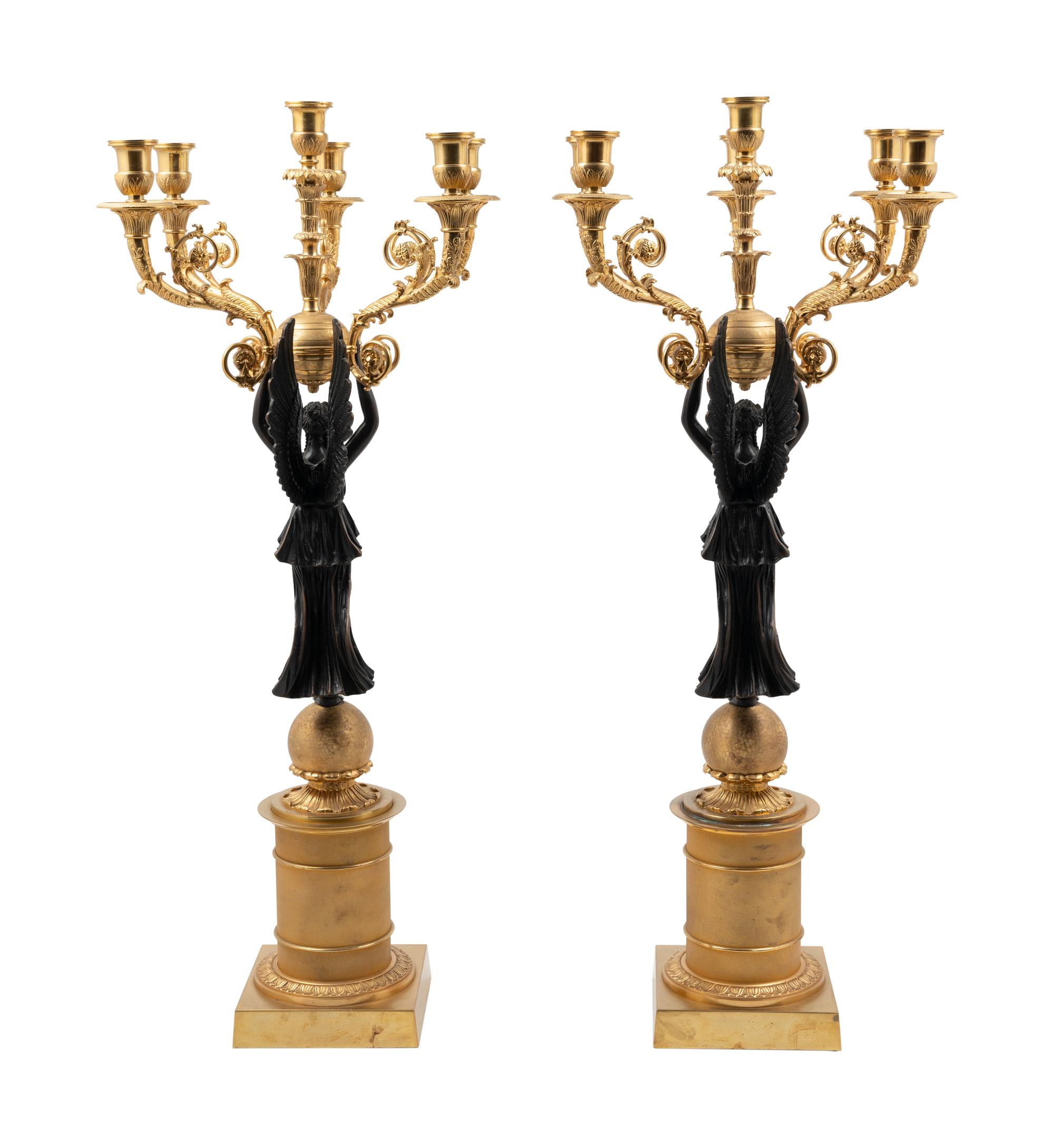 A Pair of Empire Style Gilt and Patinated Metal Six-Light Figural Candelabra