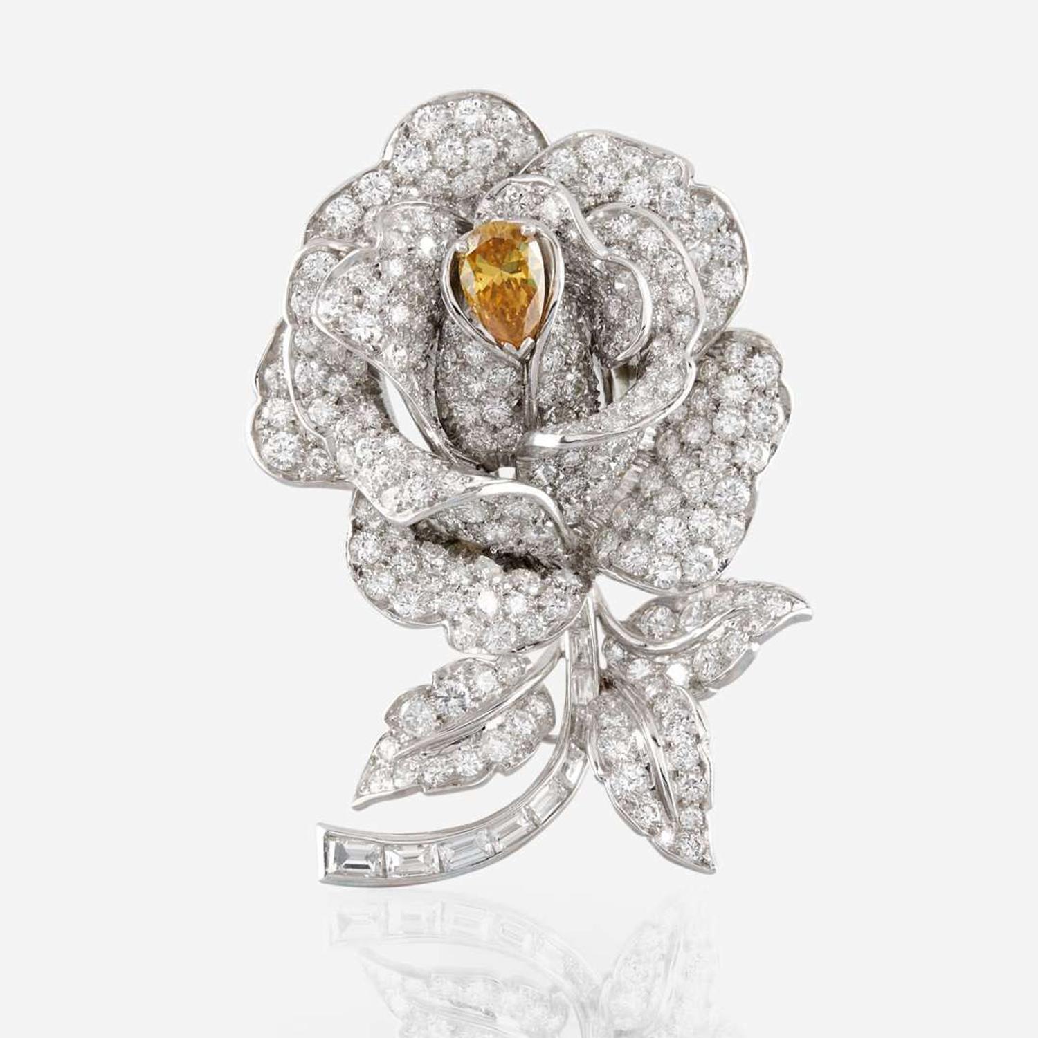 A diamond, yellow diamond, and platinum rose brooch