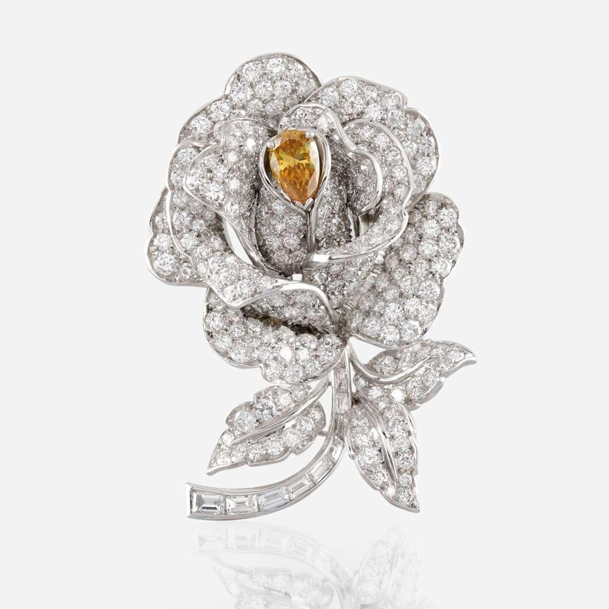 A diamond, yellow diamond, and platinum rose brooch