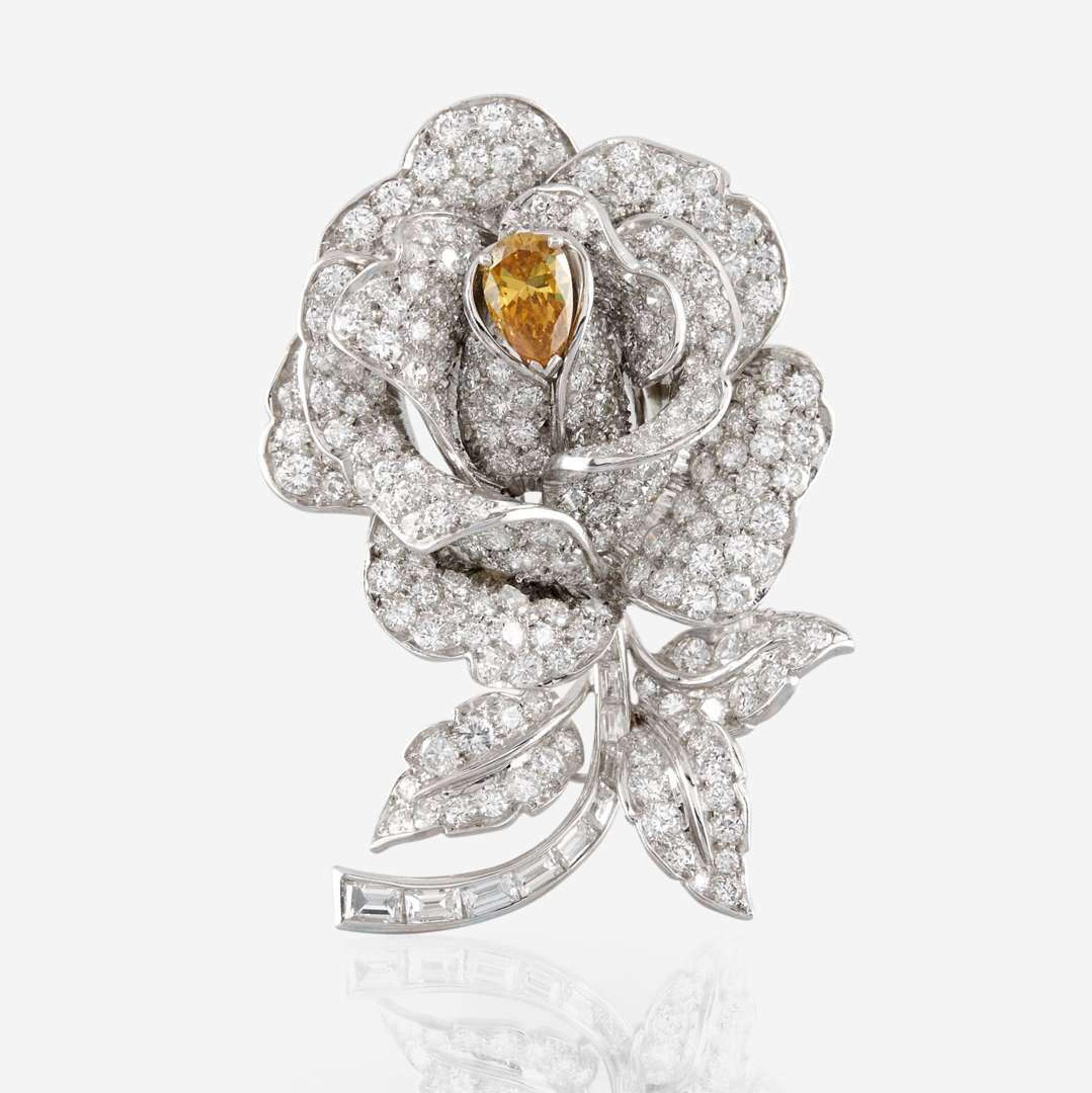 A diamond, yellow diamond, and platinum rose brooch