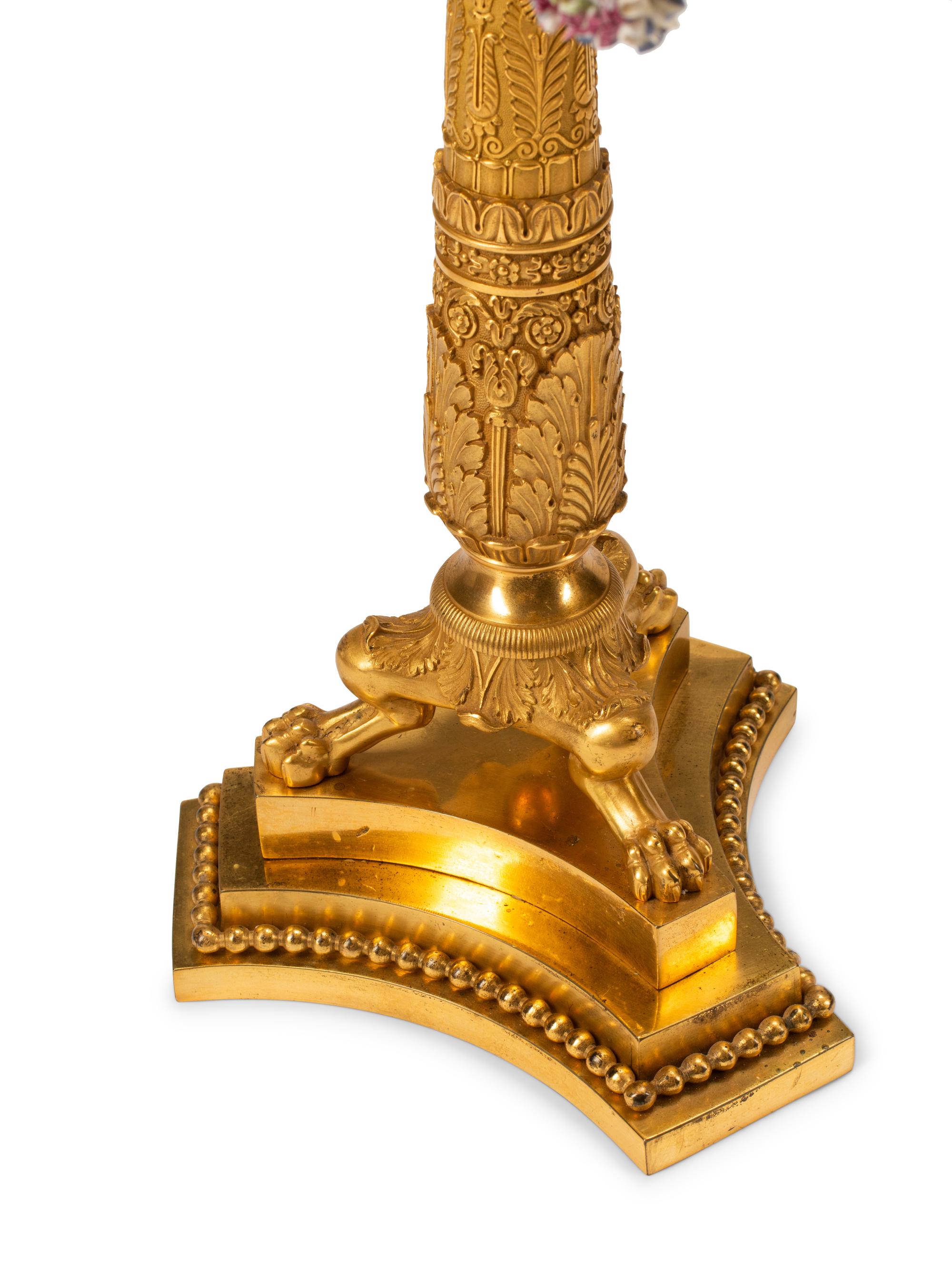 A Pair of Charles X Gilt Bronze and Porcelain Four-Light Candelabra