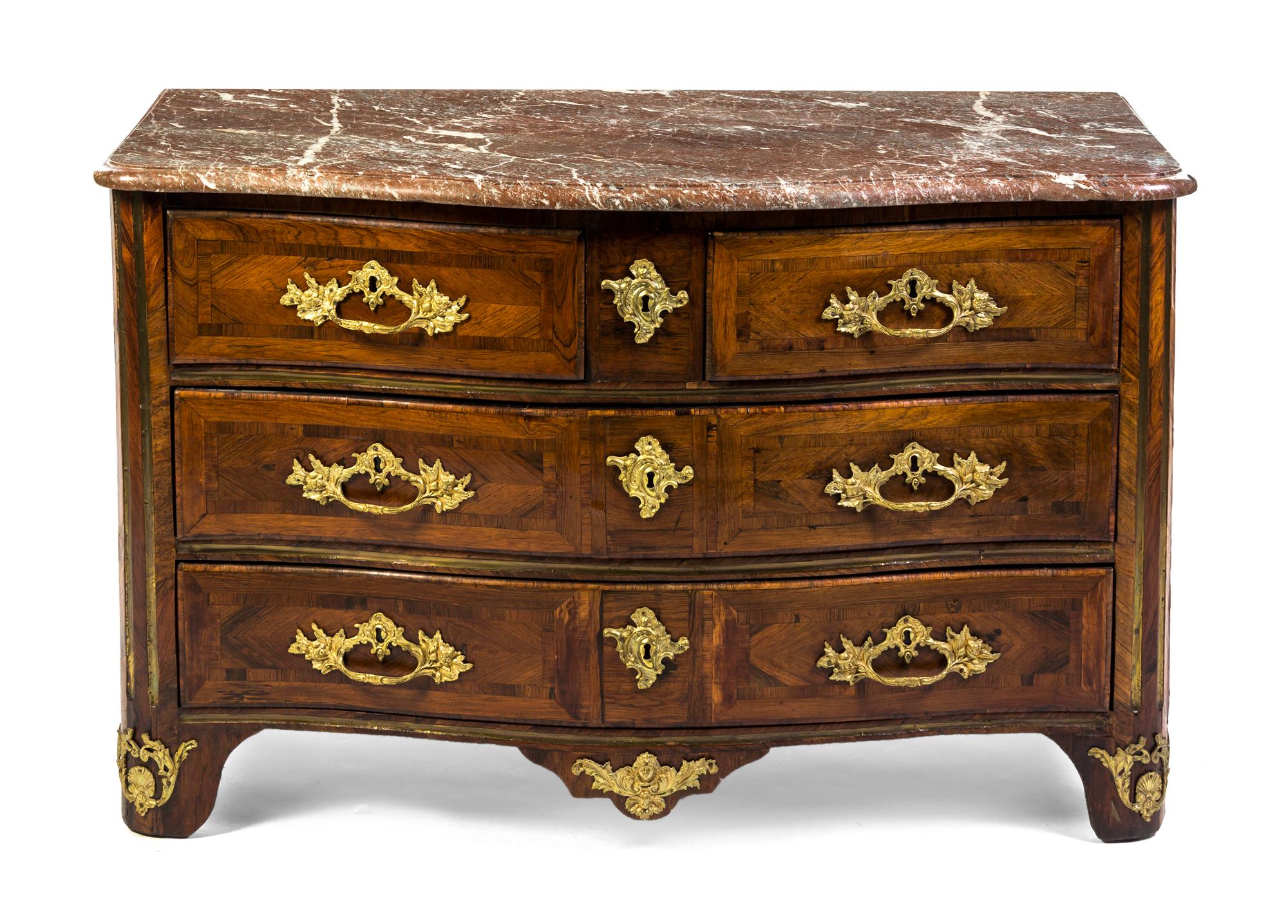 A Regence Style Parquetry and Gilt Metal Mounted Commode, Height 31 1/2 x width 49 1/2 x depth 27 3/4 inches.
