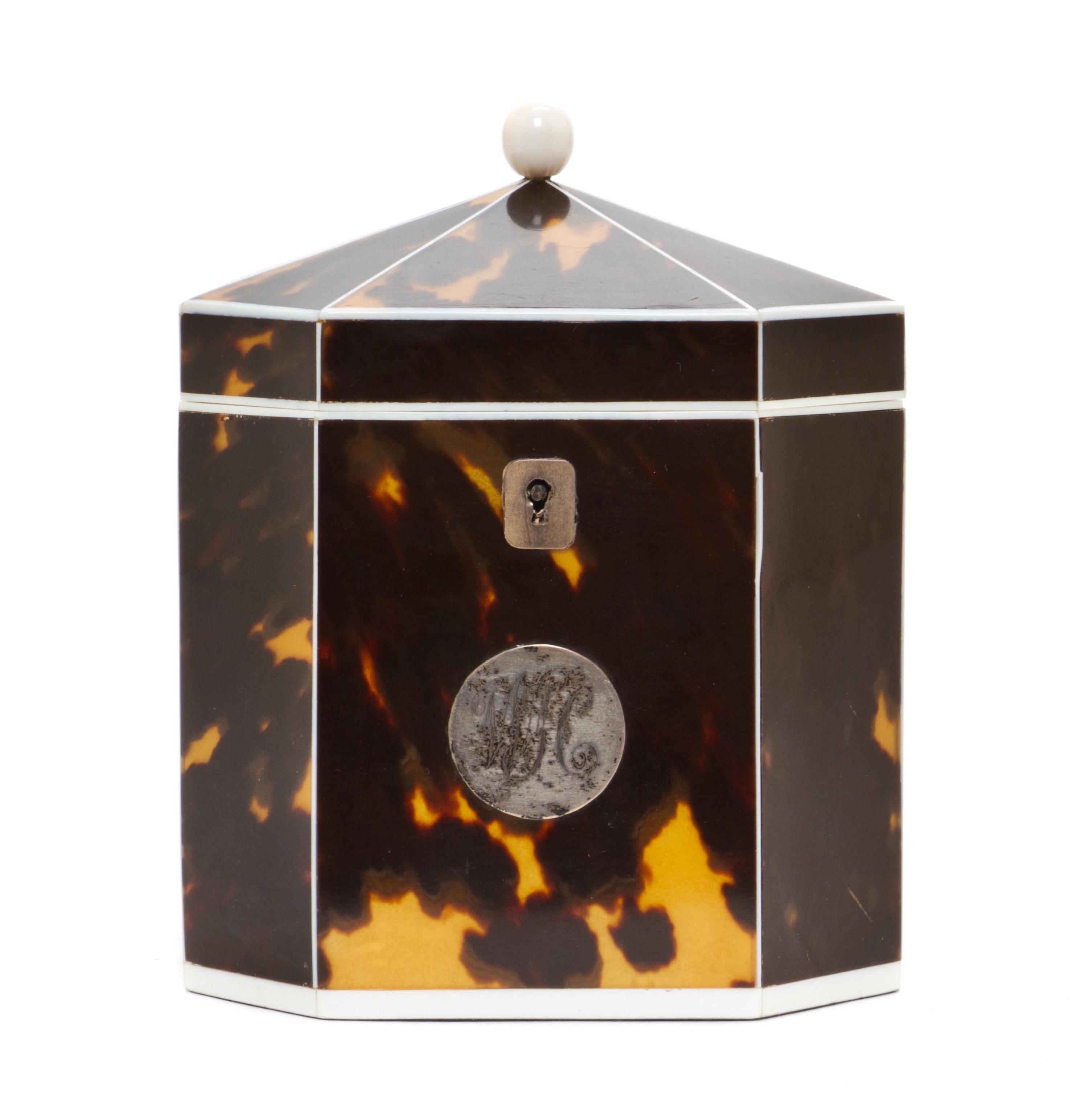 An English Tortoise Shell Tea Caddy, Height 5 1/8 x width 4 1/4 x depth 3 inches.