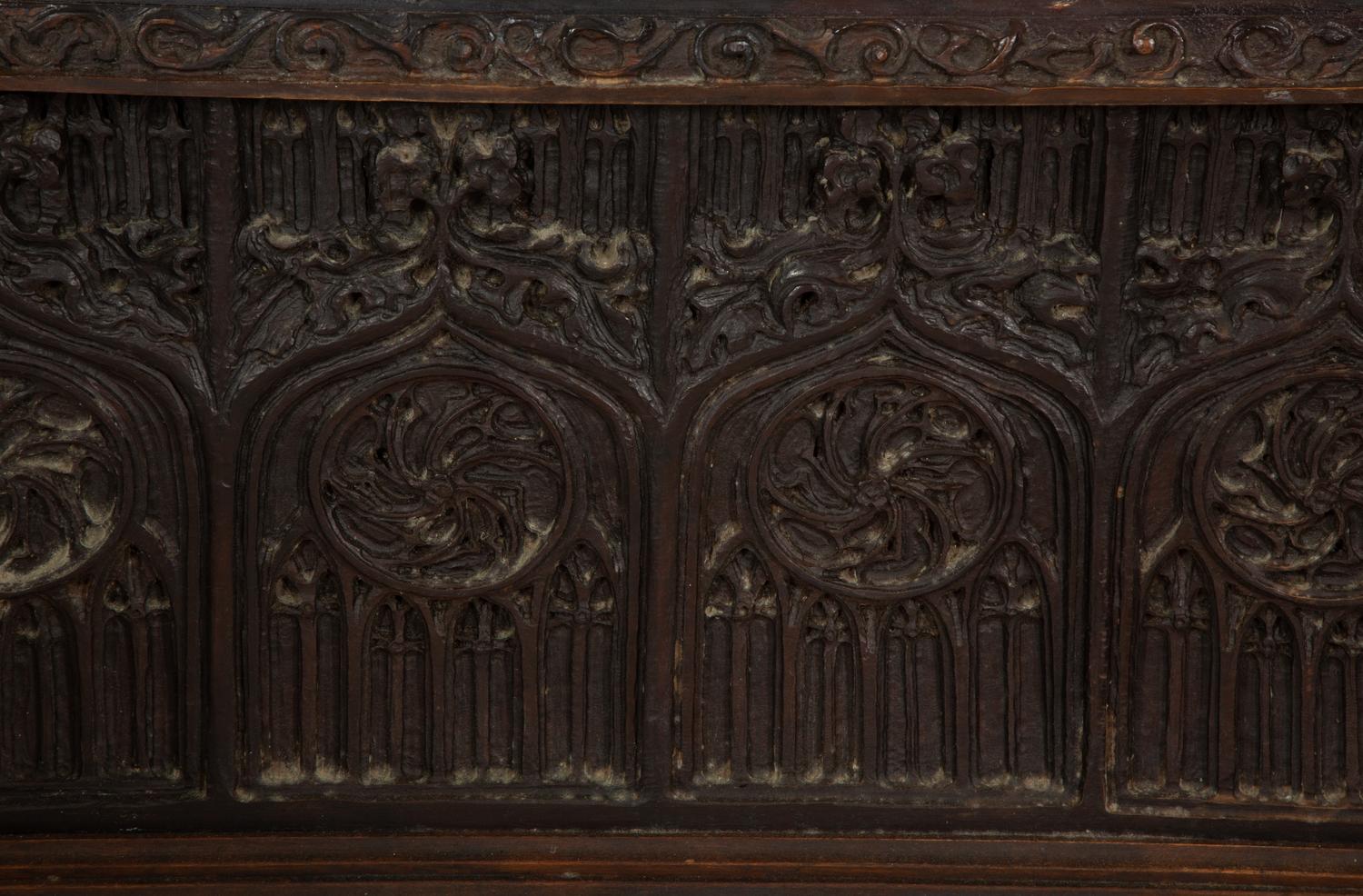 A Gothic Revival Carved Oak Tile-Mounted Chest on Stand
