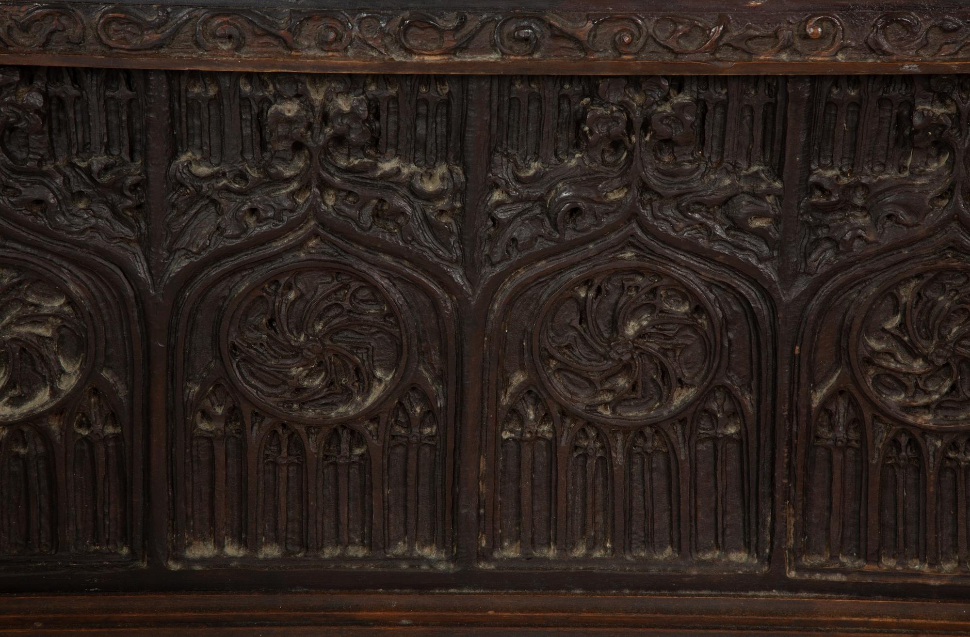 A Gothic Revival Carved Oak Tile-Mounted Chest on Stand