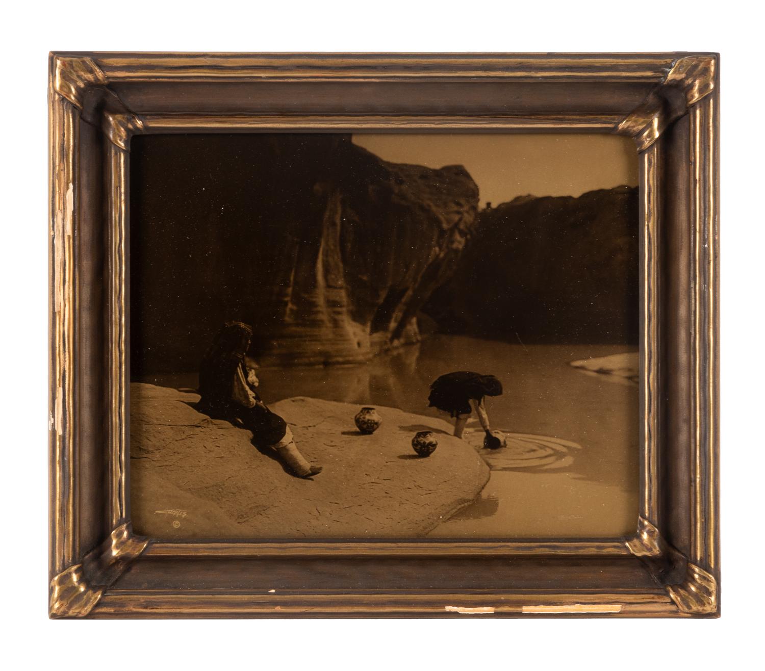 CURTIS, Edward S. (1868-1952), photographer. At the Old Well in Acoma .