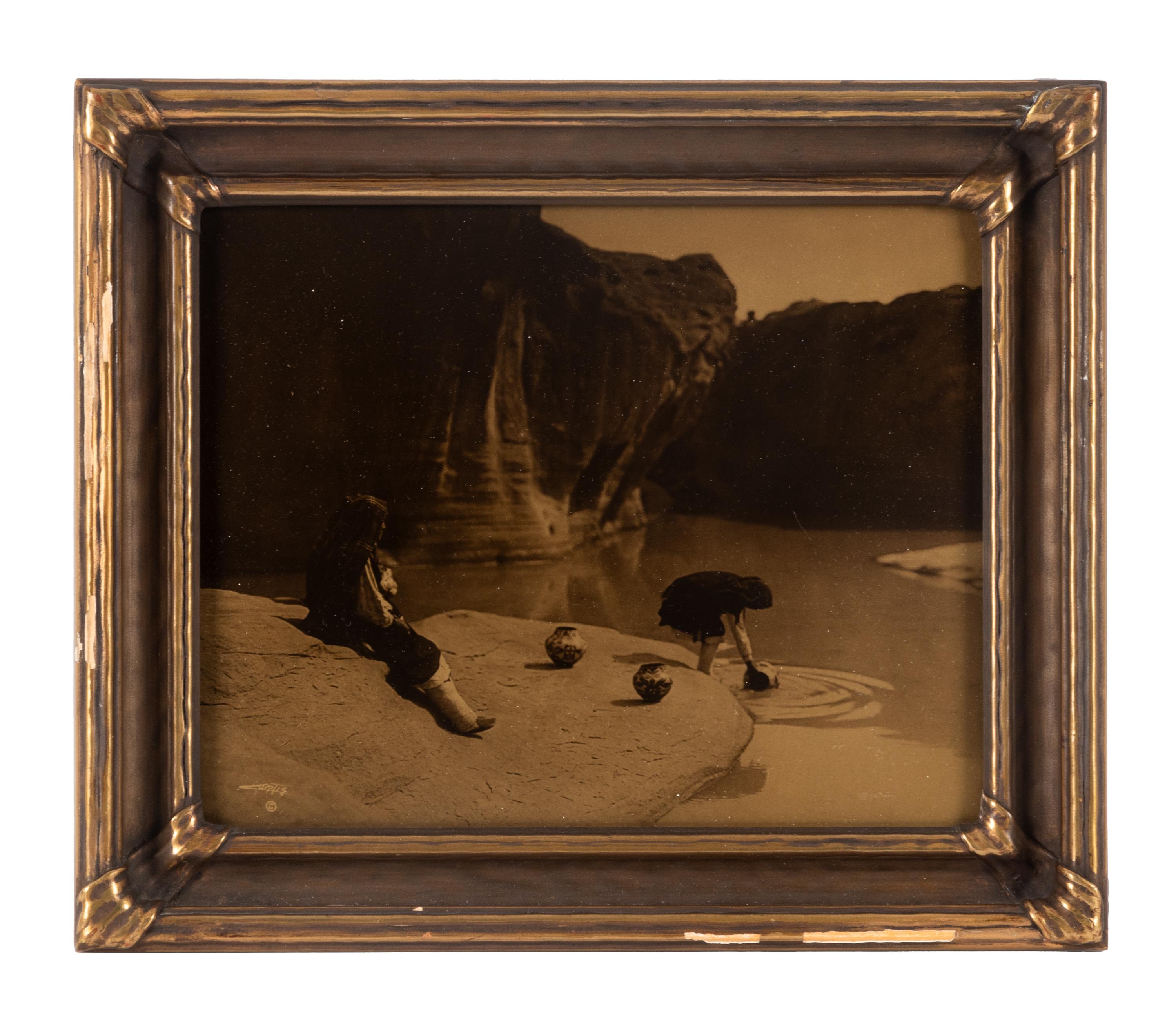 CURTIS, Edward S. (1868-1952), photographer. At the Old Well in Acoma .