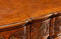 A Louis XV Provincial Carved Walnut Commode