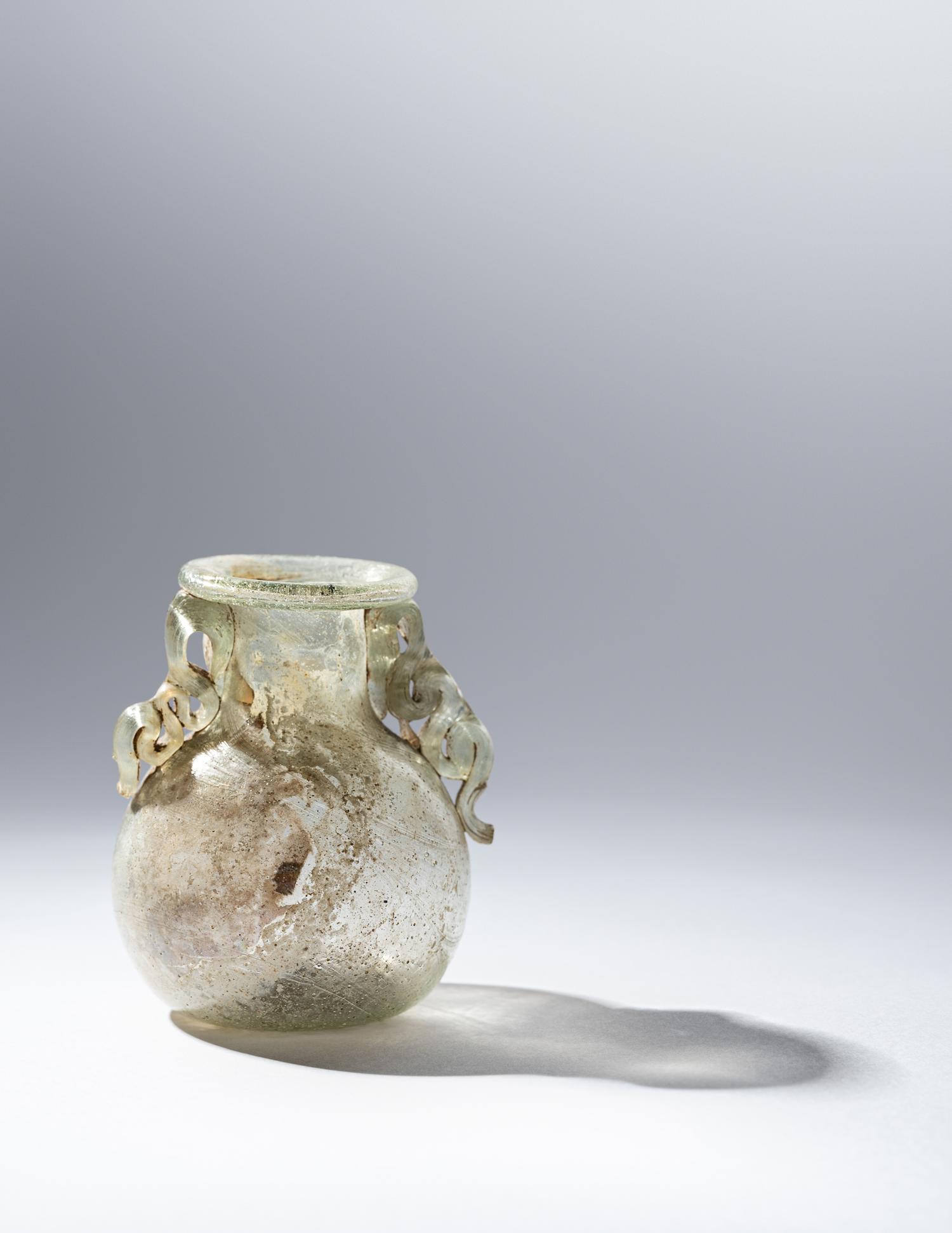 A Roman Green Glass Araballos