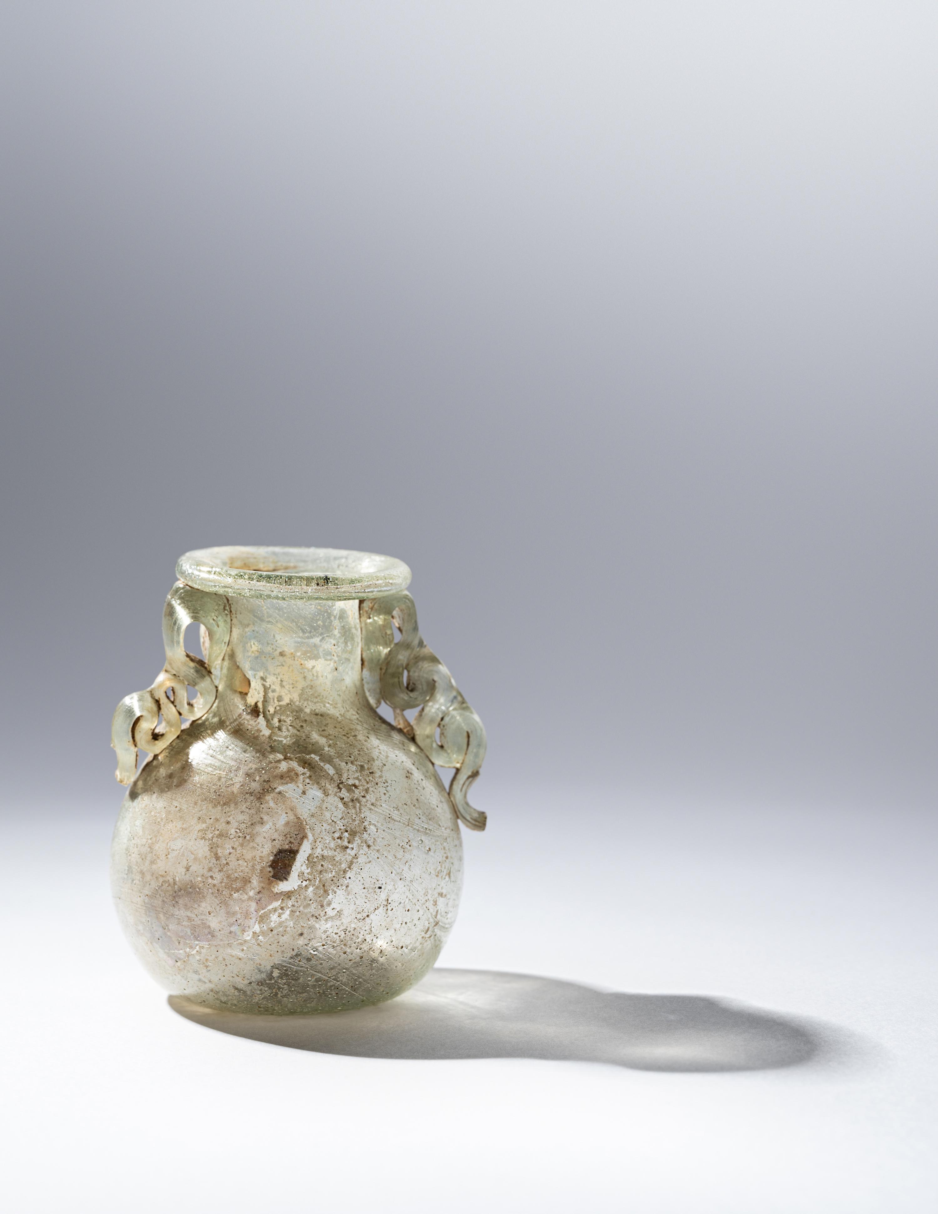 A Roman Green Glass Araballos