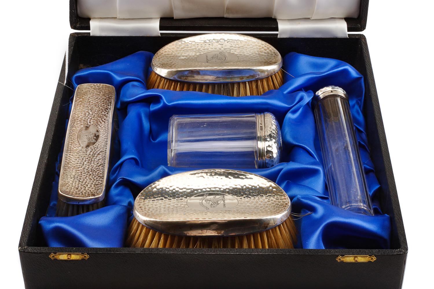 An Edwardian Silver Mounted Five-Piece Dresser Set, H. Matthews, Birmingham, 1902 and Others, comprising three brushes and two silver-m