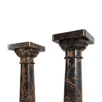 A Pair of Carved Marble Pedestals