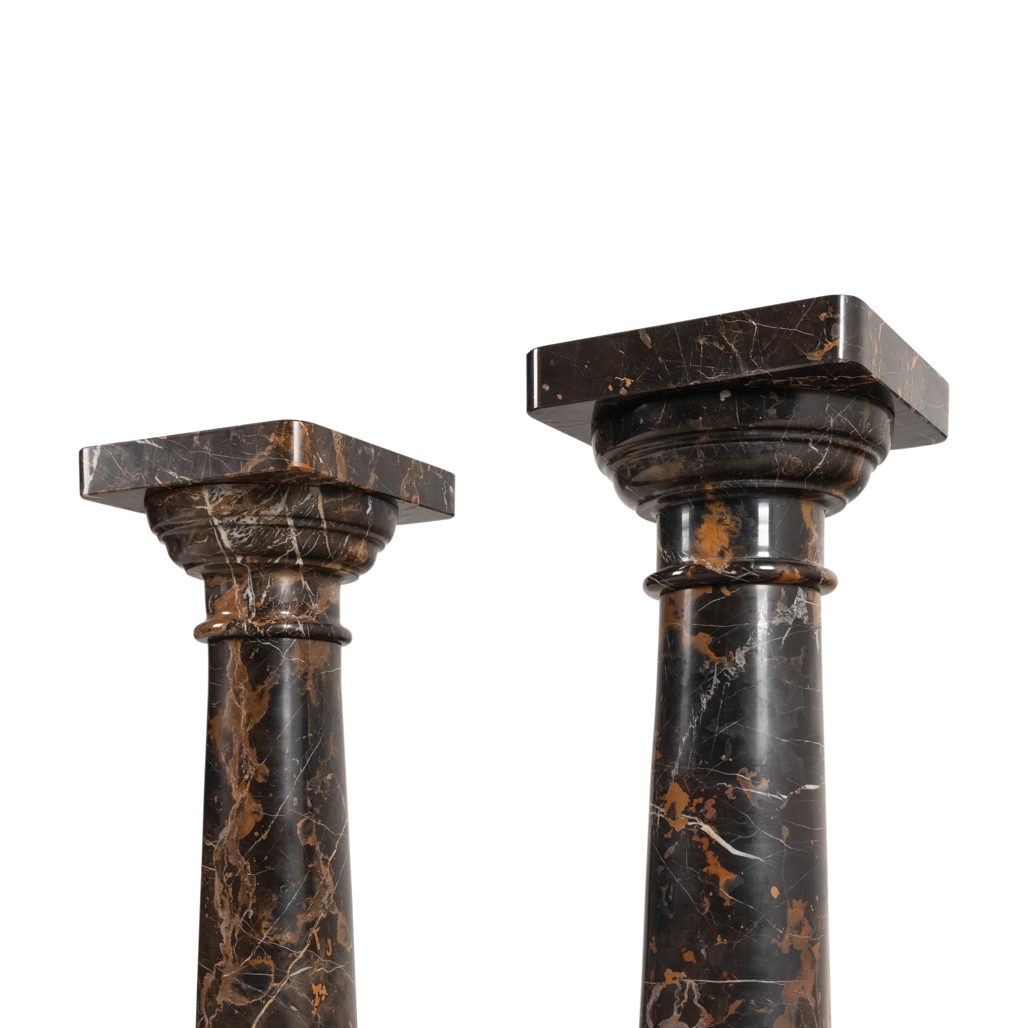 A Pair of Carved Marble Pedestals