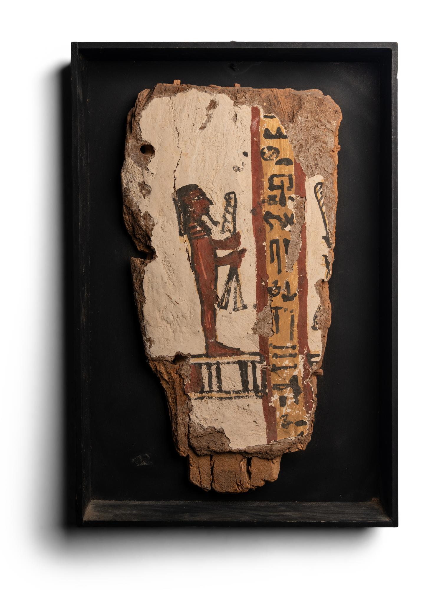 An Egyptian Painted Wood Sarcophagus Fragment
