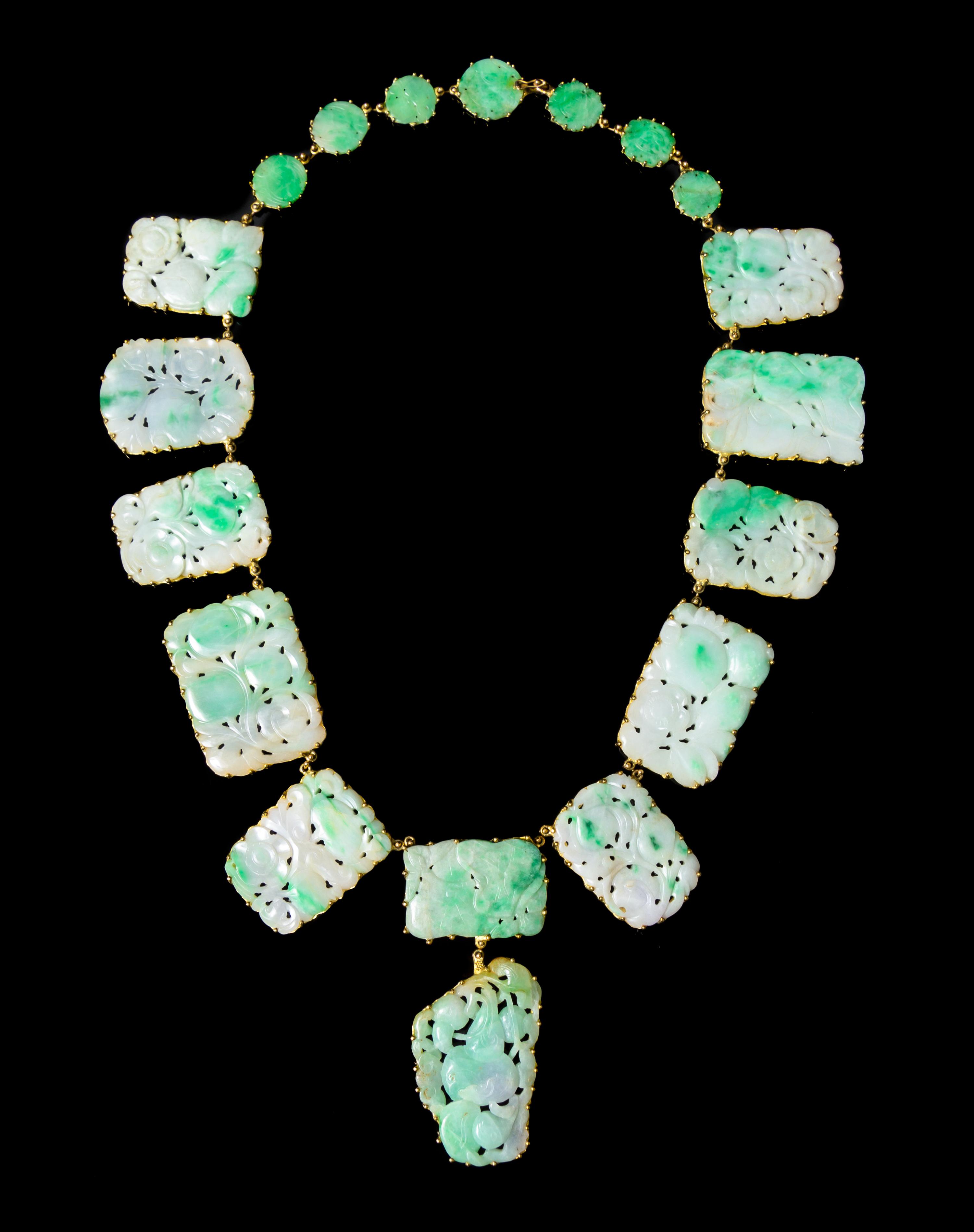 An 18 Karat Gold and Jadeite Necklace Length overall 24 inches.