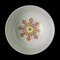 A Chinese Yellow Sgraffito Ground Famille Rose Porcelain 'Medallion' Bowl, Daoguang Mark 道光款 黃釉軋地粉彩開光節令膳盌