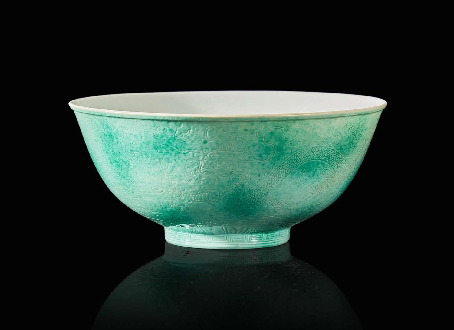 A Chinese incised porcelain faux-jadeite "Dragons" bowl, Tongzhi mark and of the period 龍紋瓷盌 同治款 清同治