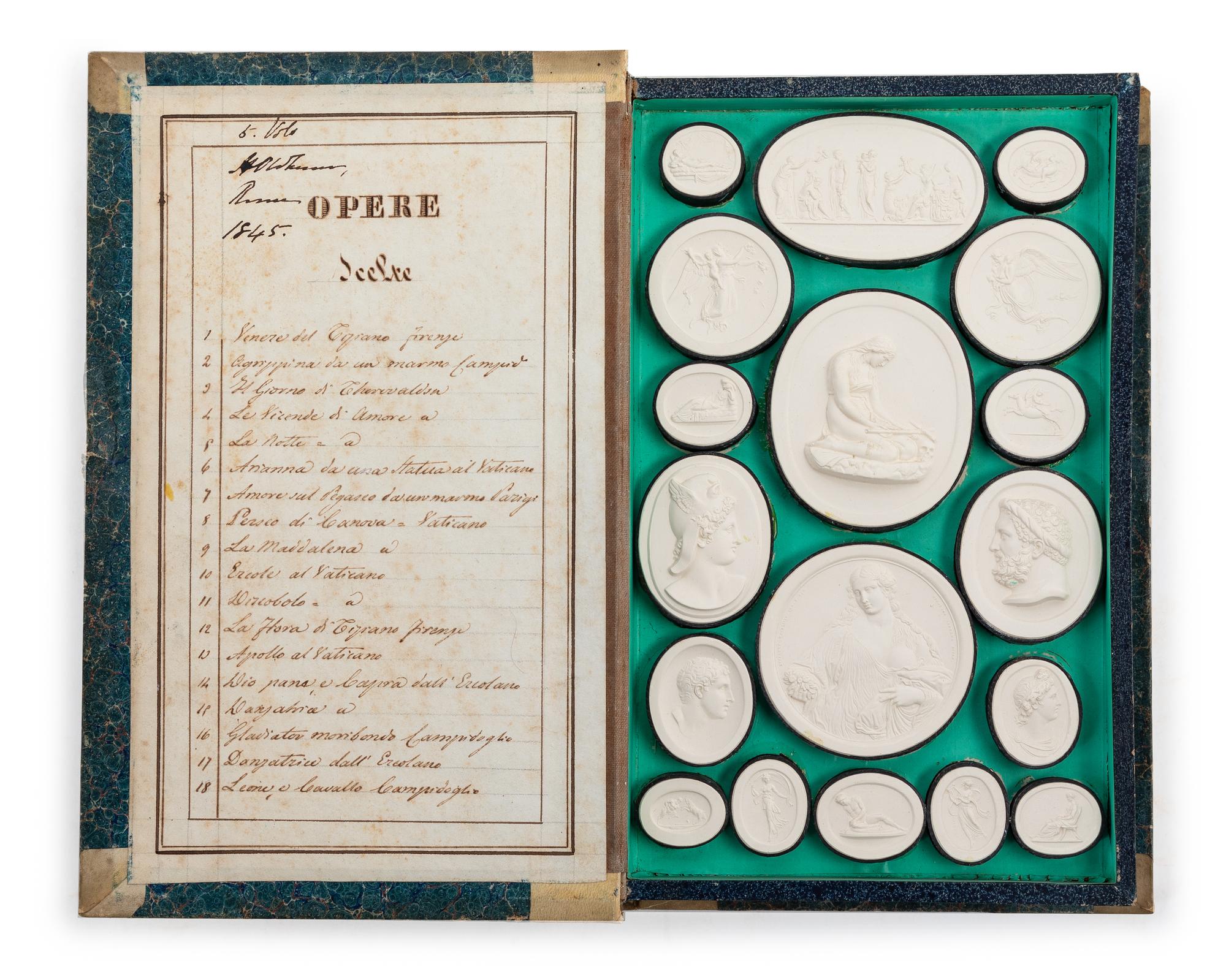 A Collection of Grand Tour Plaster Intaglios Faux book: height 2 x width 10 1/4 x depth 6 3/4 inches. — 19TH CENTURY