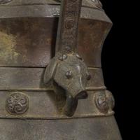 A Chinese patinated bronze archaistic vessel and cover, you 复古风格铜提梁卣