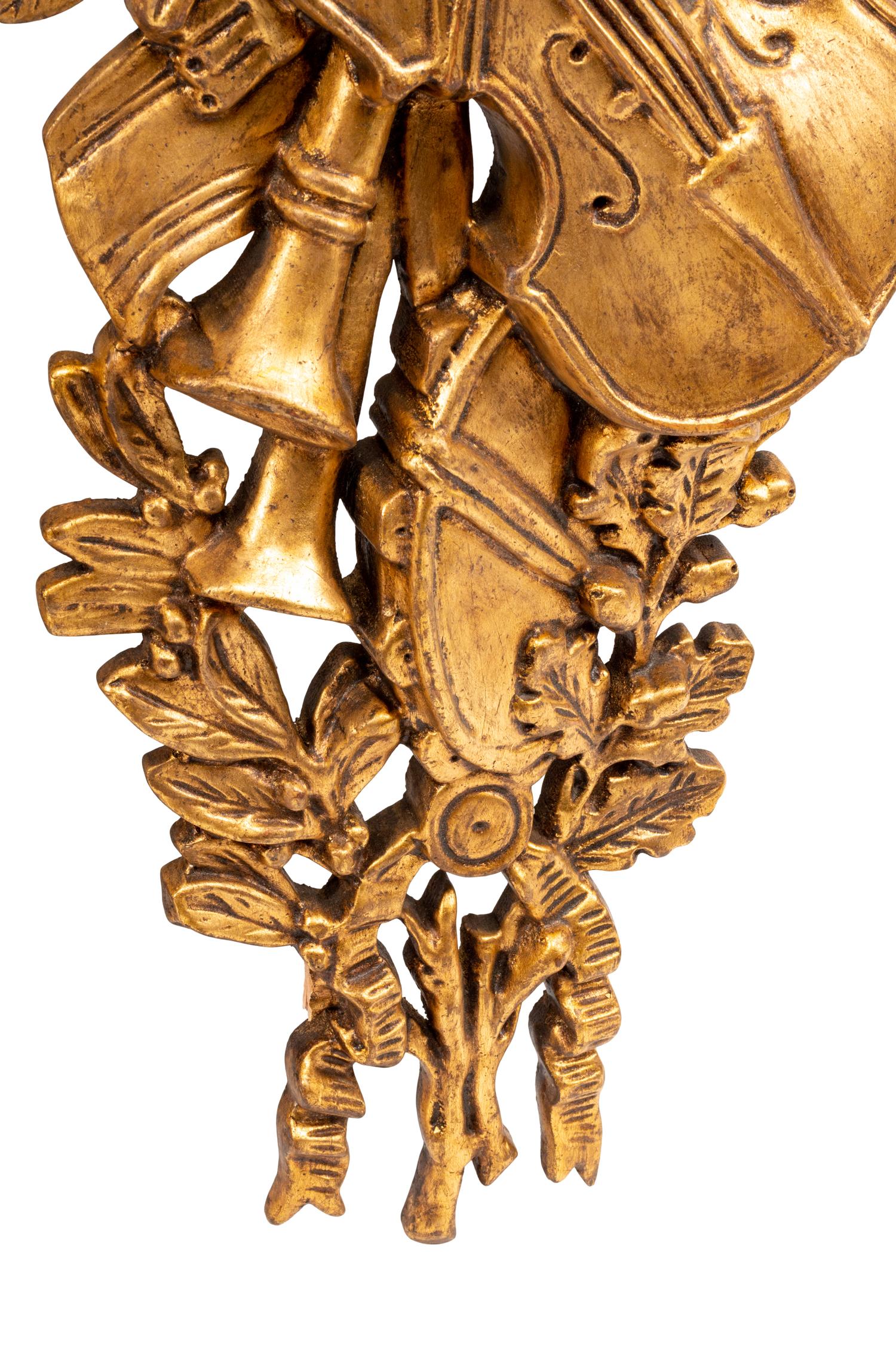 A Set of Four French Giltwood Trophy Appliqués