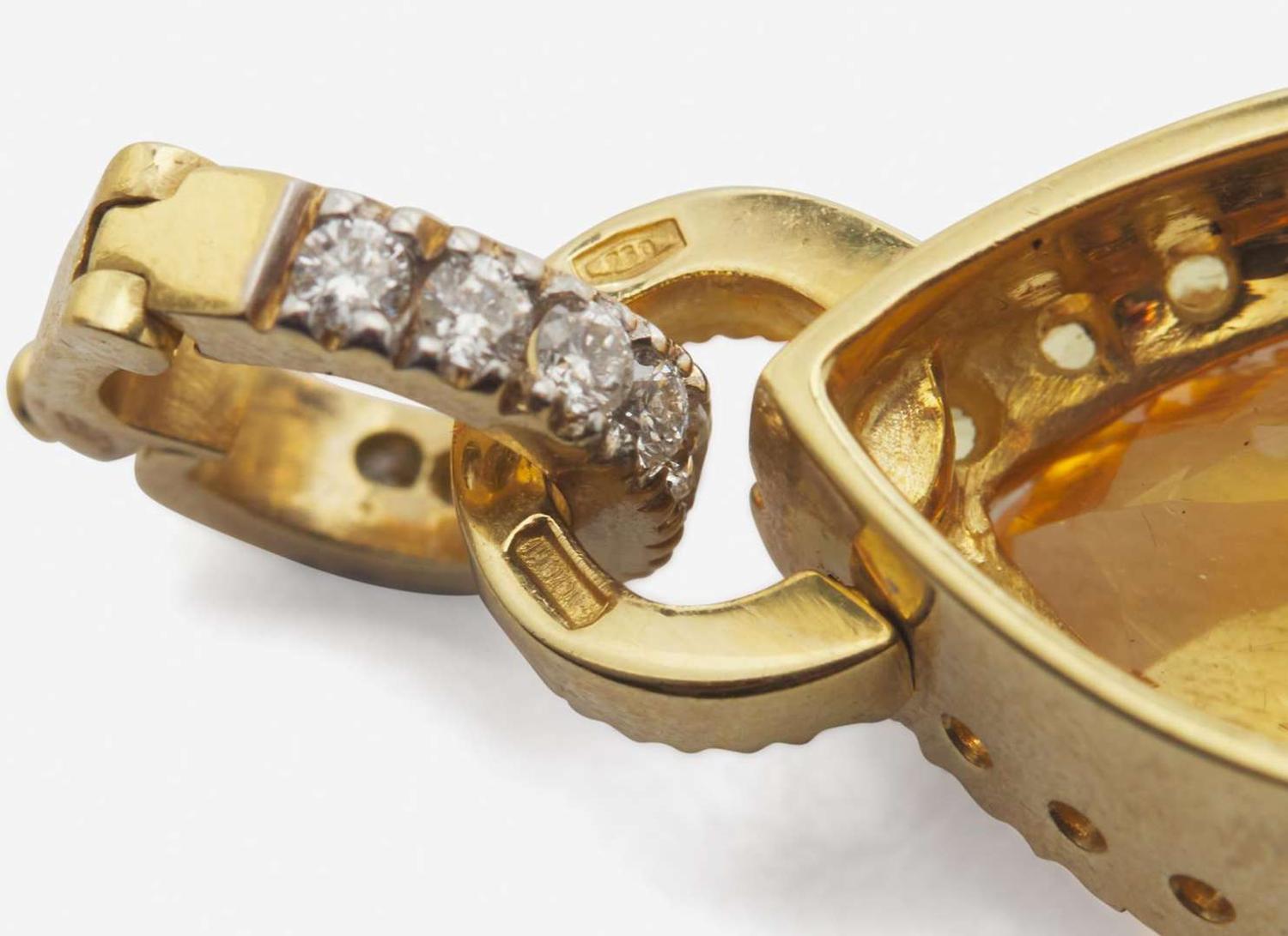 An 18K Yellow Gold and Gemstone Clip