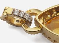 An 18K Yellow Gold and Gemstone Clip