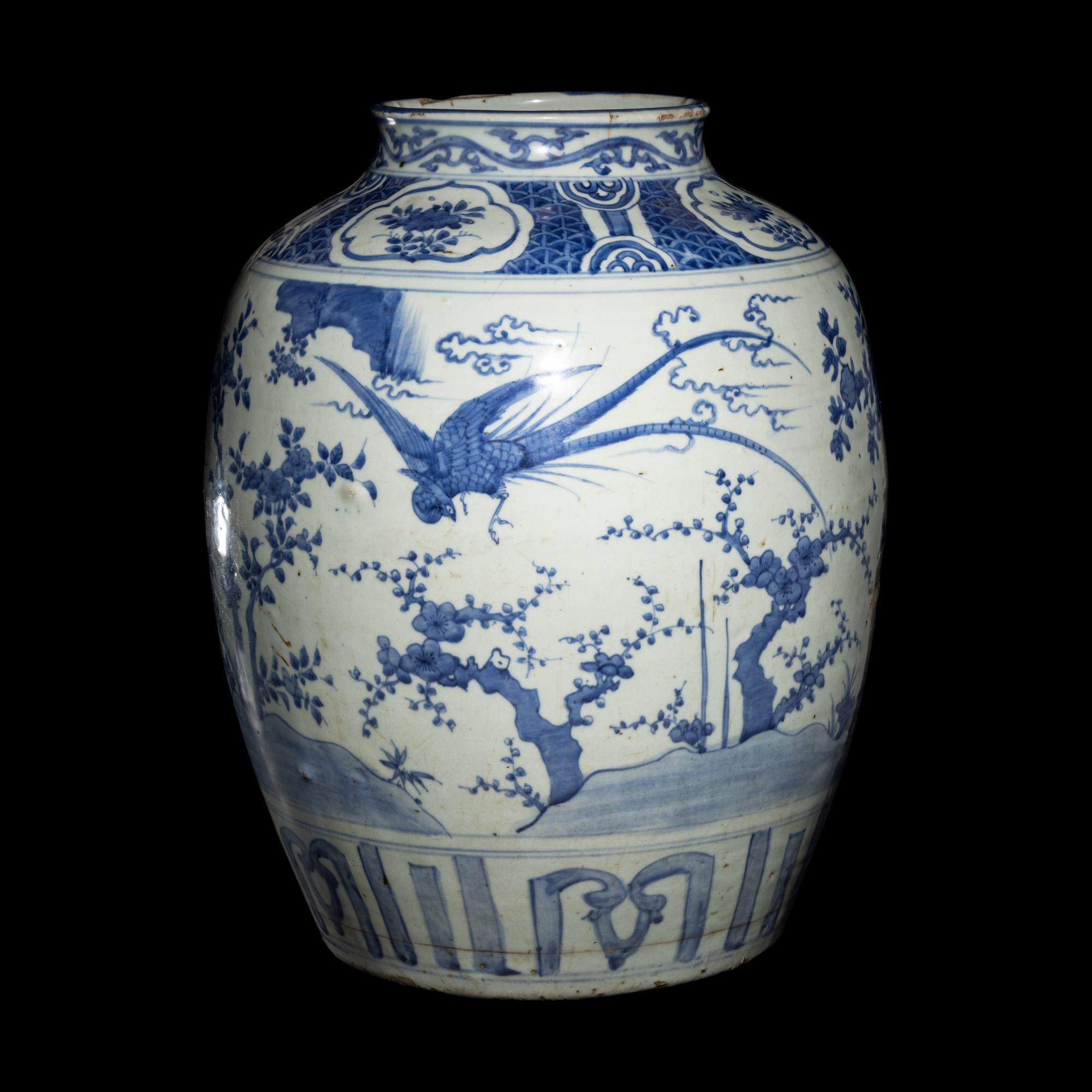 A Chinese Blue and White 'Birds and Trees' Porcelain Jar, 16th/17th Century 明末清初 青花花鳥圖大罐