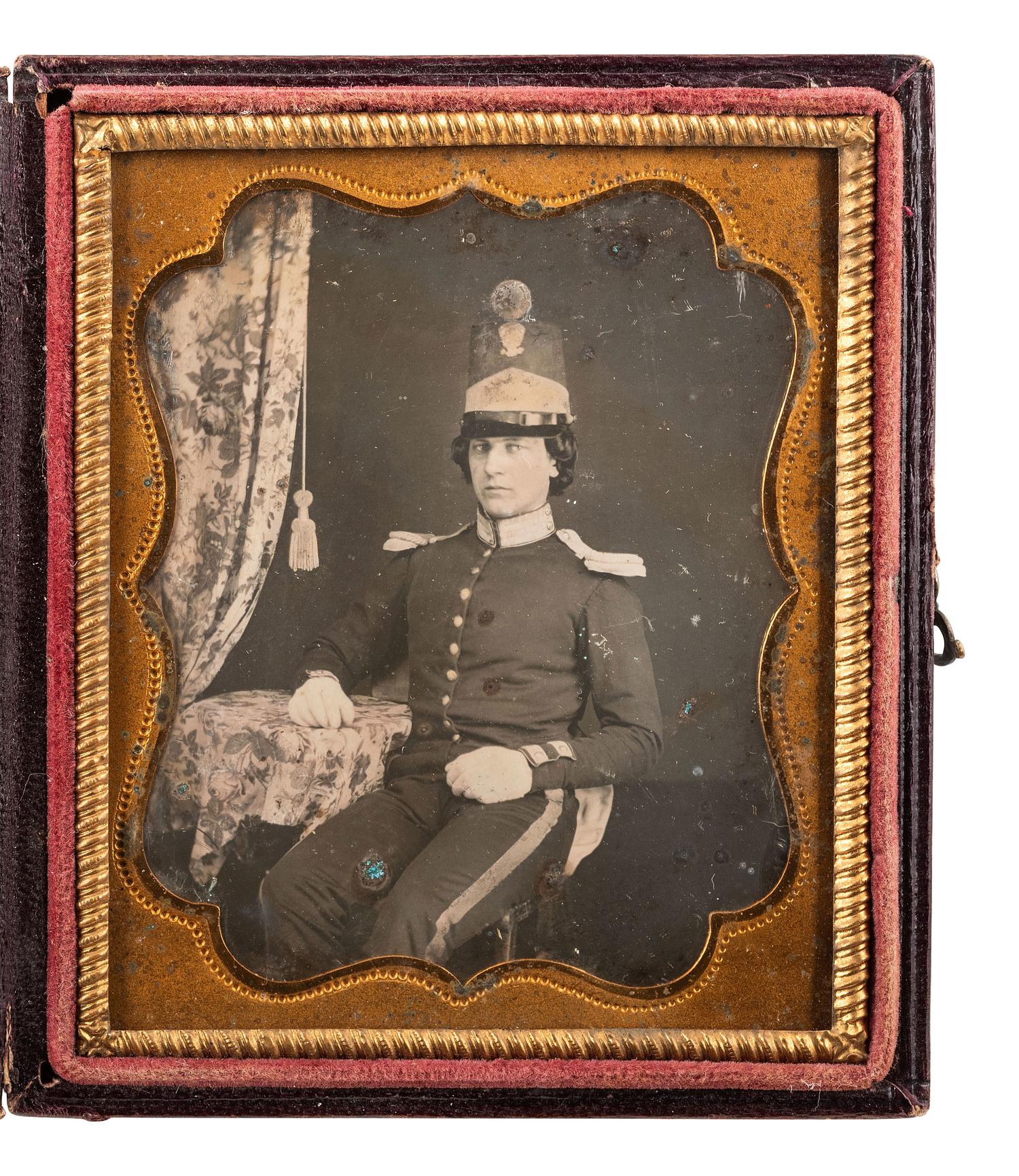 [MILITARIA - EARLY PHOTOGRAPHY]. Sixth plate daguerreotype of a militiaman wearing a shako with eagle and pompon. Ca 1850s.