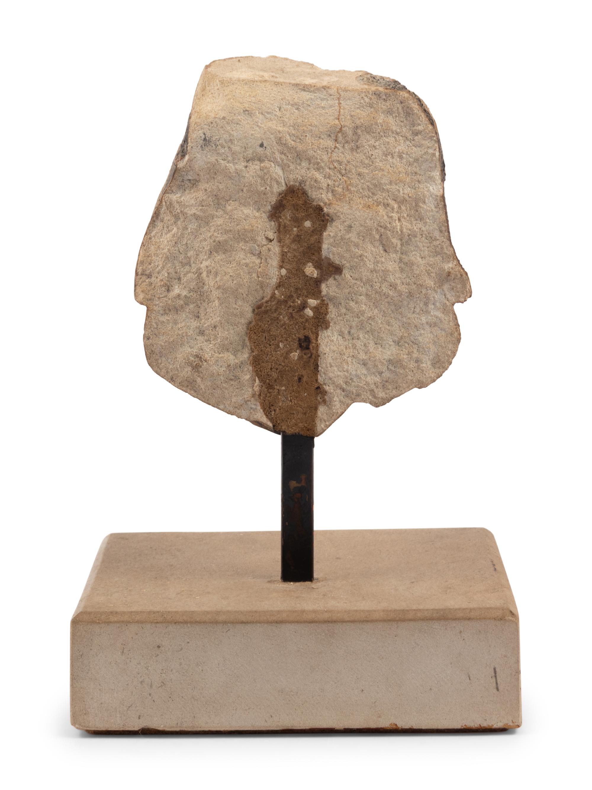 A Continental Carved Stone Head