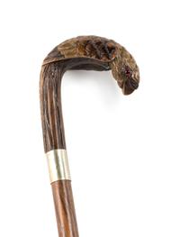 A Carved Wood Cane, Length of handle 5 1/4 x length overall 35 3/4 inches.