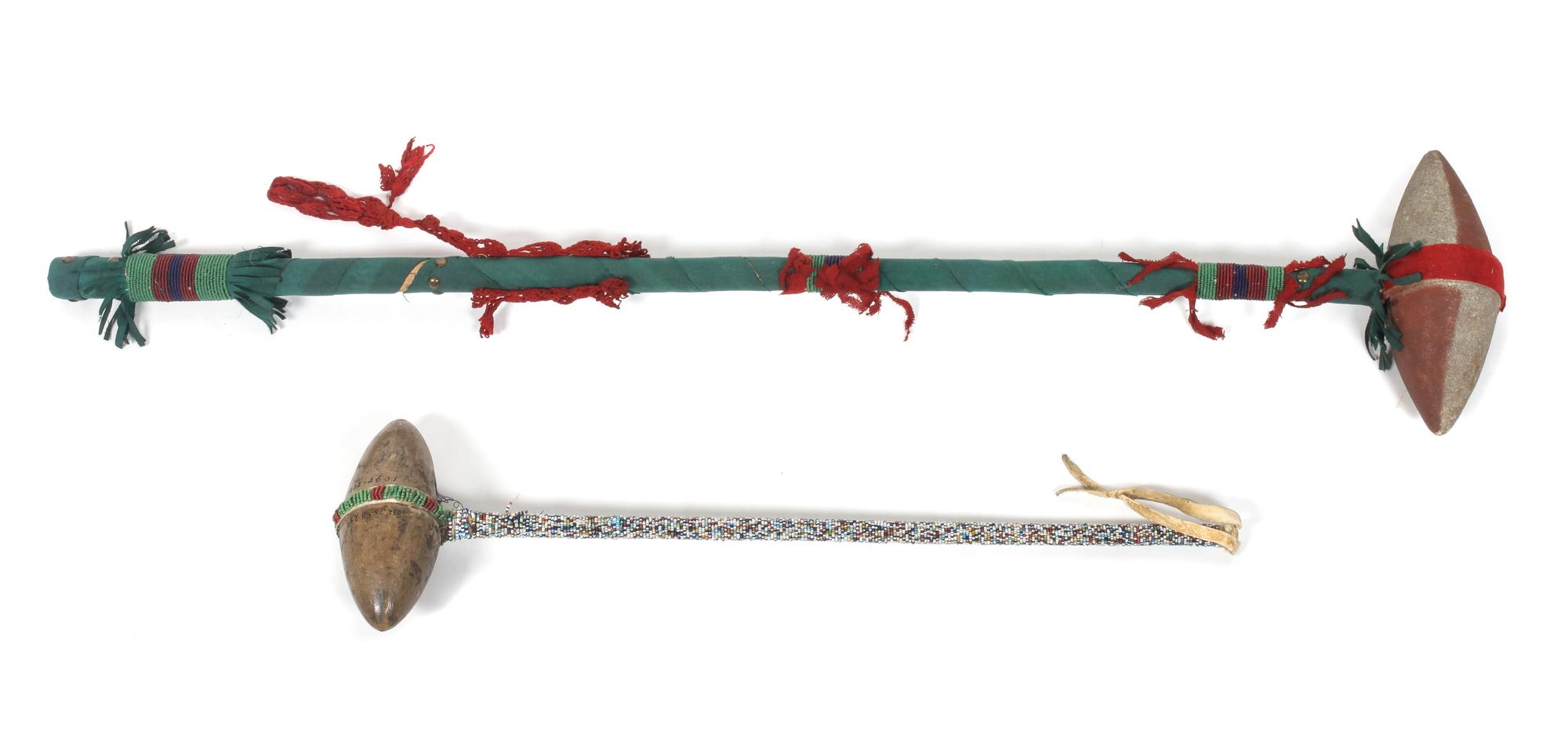 Two Stone and Wood Clubs Length 37 1/2 inches.