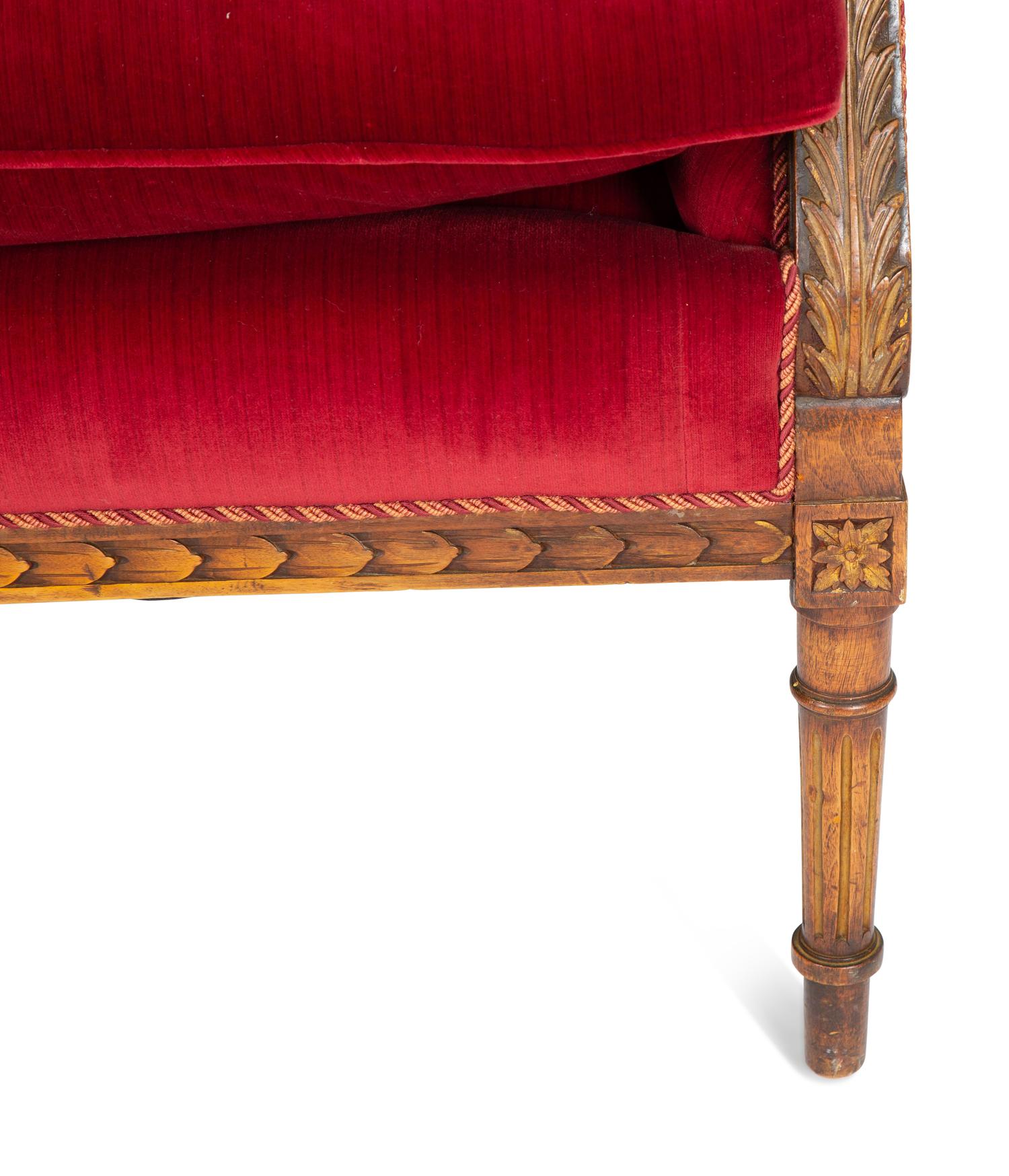 A Louis XVI Style Parcel Gilt Walnut Sofa