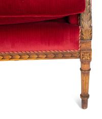 A Louis XVI Style Parcel Gilt Walnut Sofa