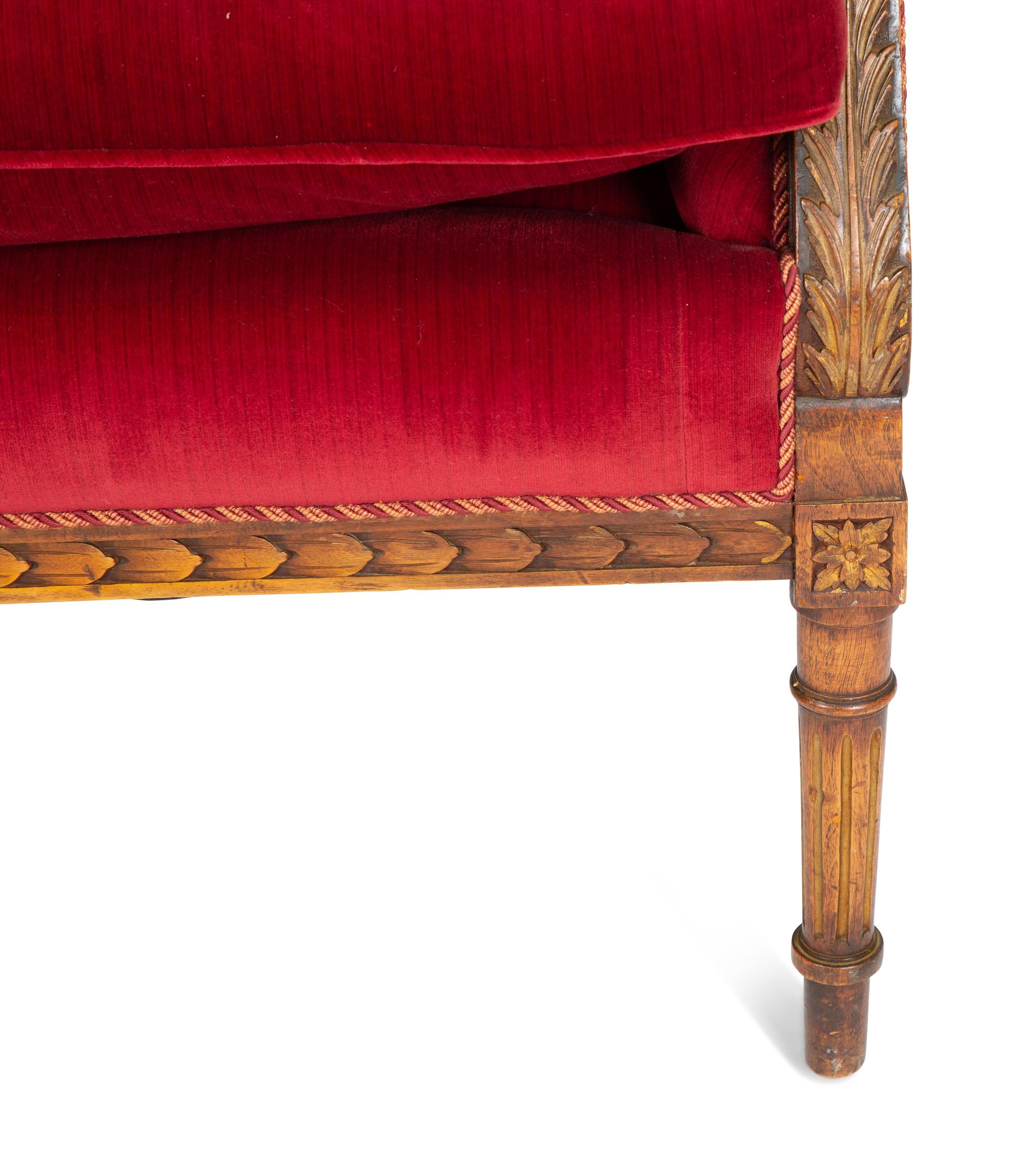A Louis XVI Style Parcel Gilt Walnut Sofa