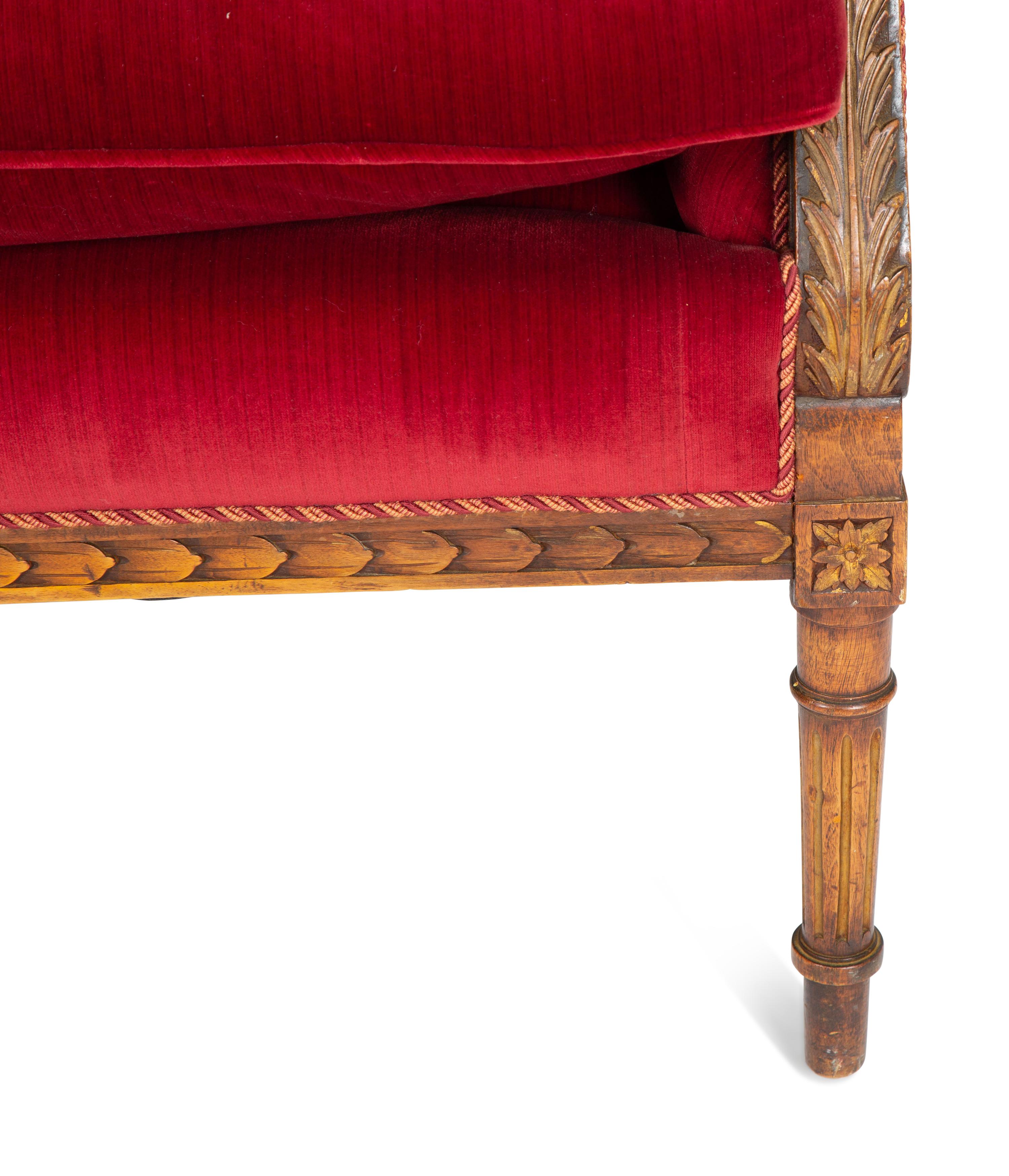 A Louis XVI Style Parcel Gilt Walnut Sofa