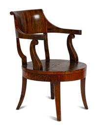 A Continental Barrel-Back Armchair