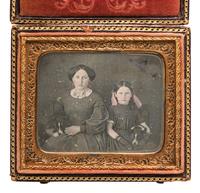 [EARLY PHOTOGRAPHY]. Sixth plate daguerreotype featuring a mother and daughter holding matching canine companions.
