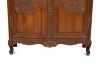 A French Provincial Carved Oak Armoire