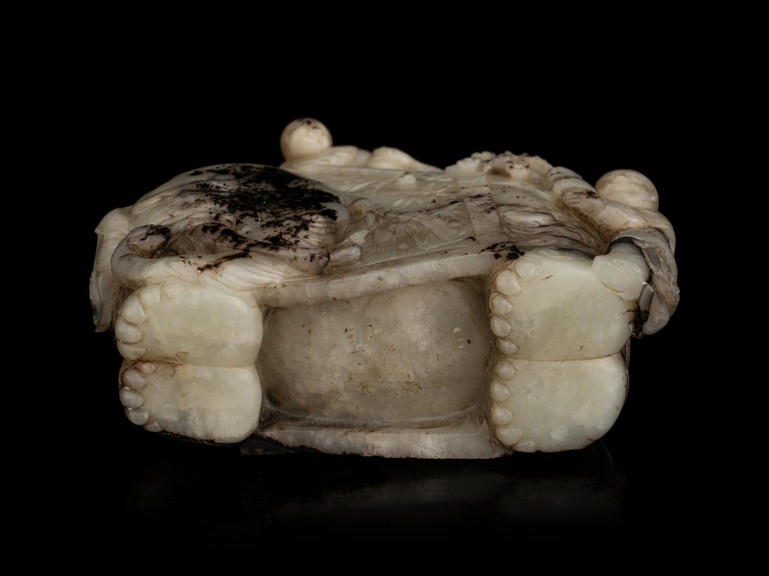 A Carved Jade ‘Elephant and Children’ Figural Group
